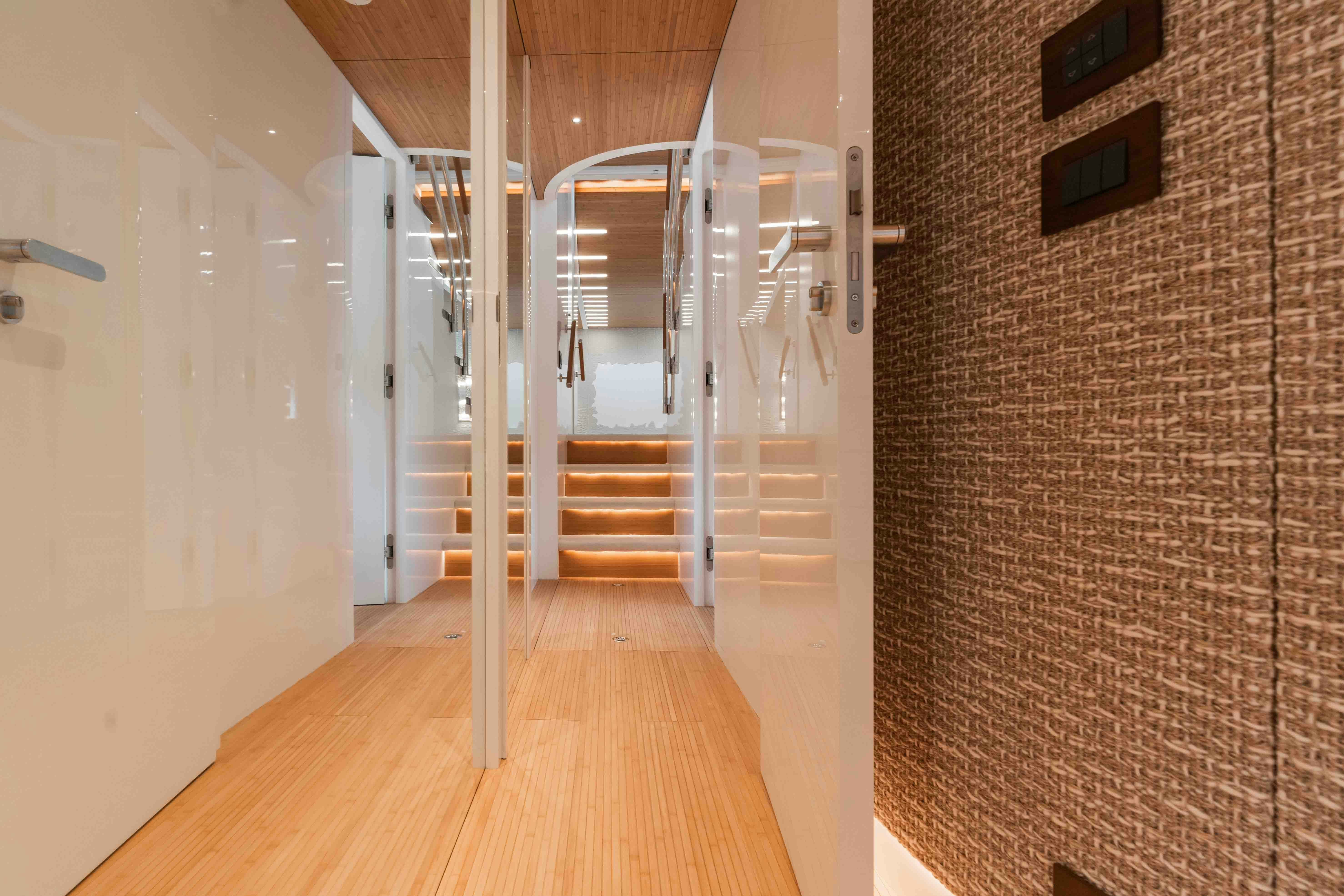 a hallway with a wood floor and a staircase aboard NB 202 Yacht for Sale