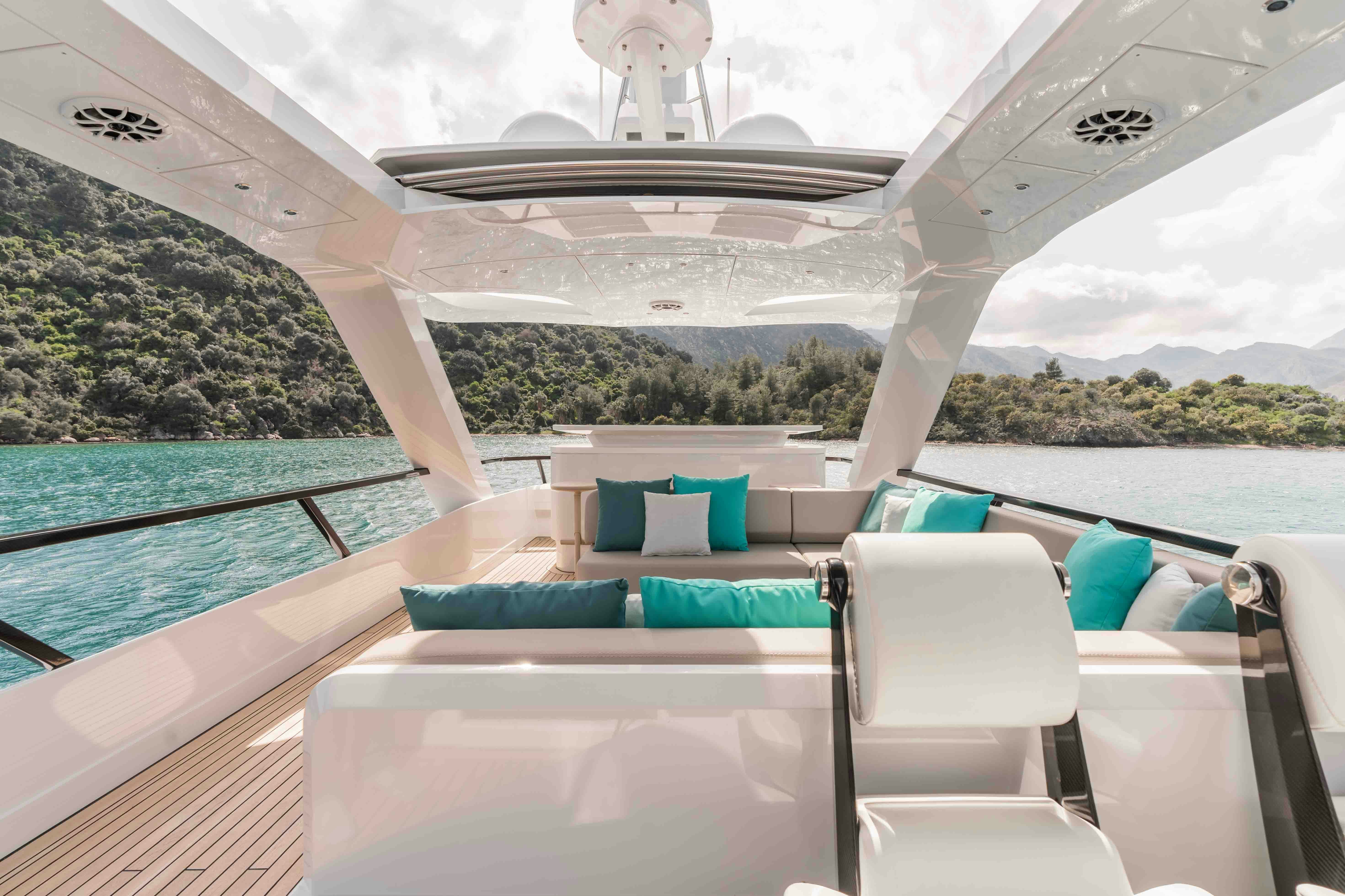 a lounge chair on a deck overlooking a body of water aboard NB 202 Yacht for Sale
