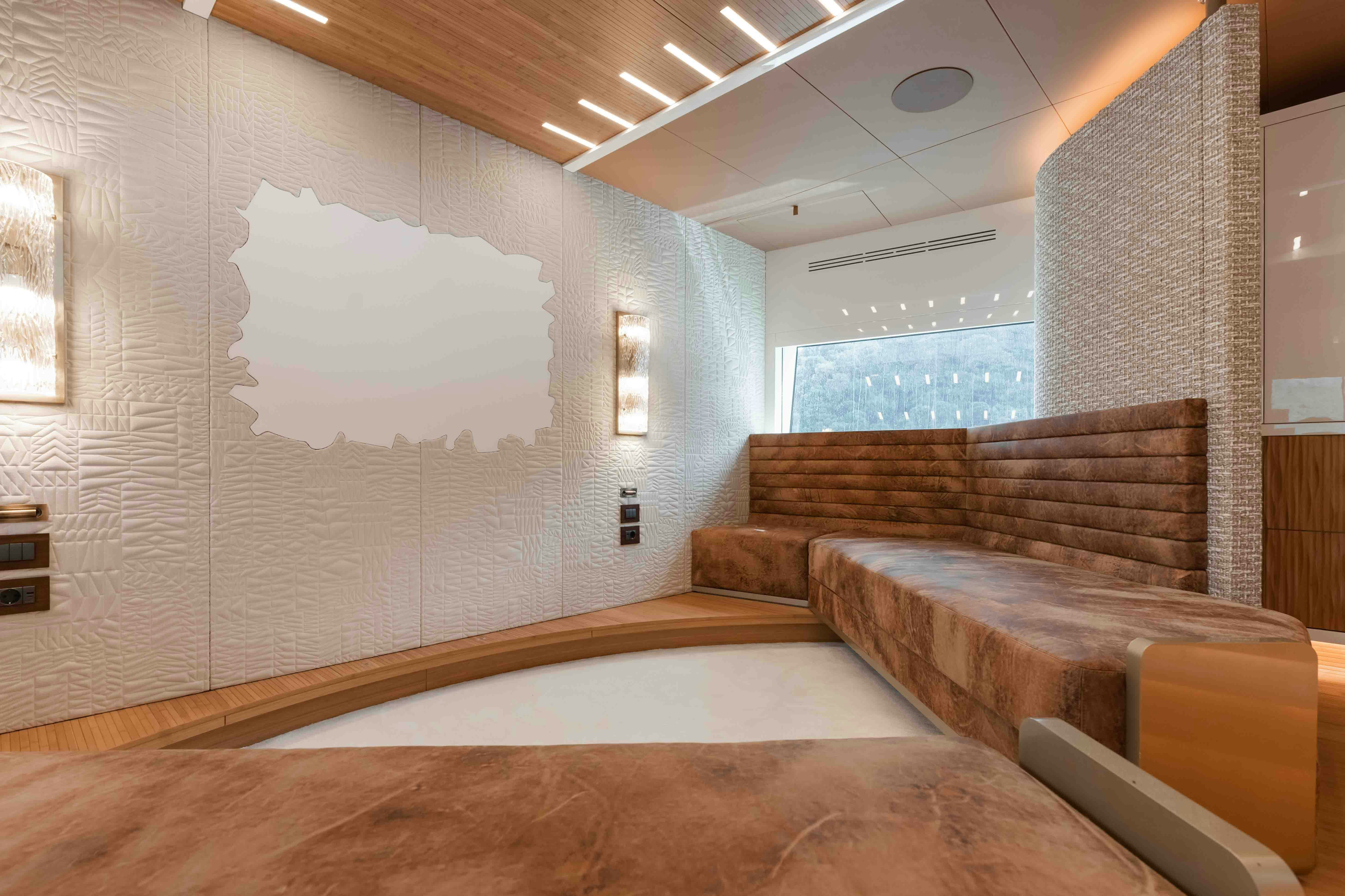 a room with a couch and a bed aboard NB 202 Yacht for Sale