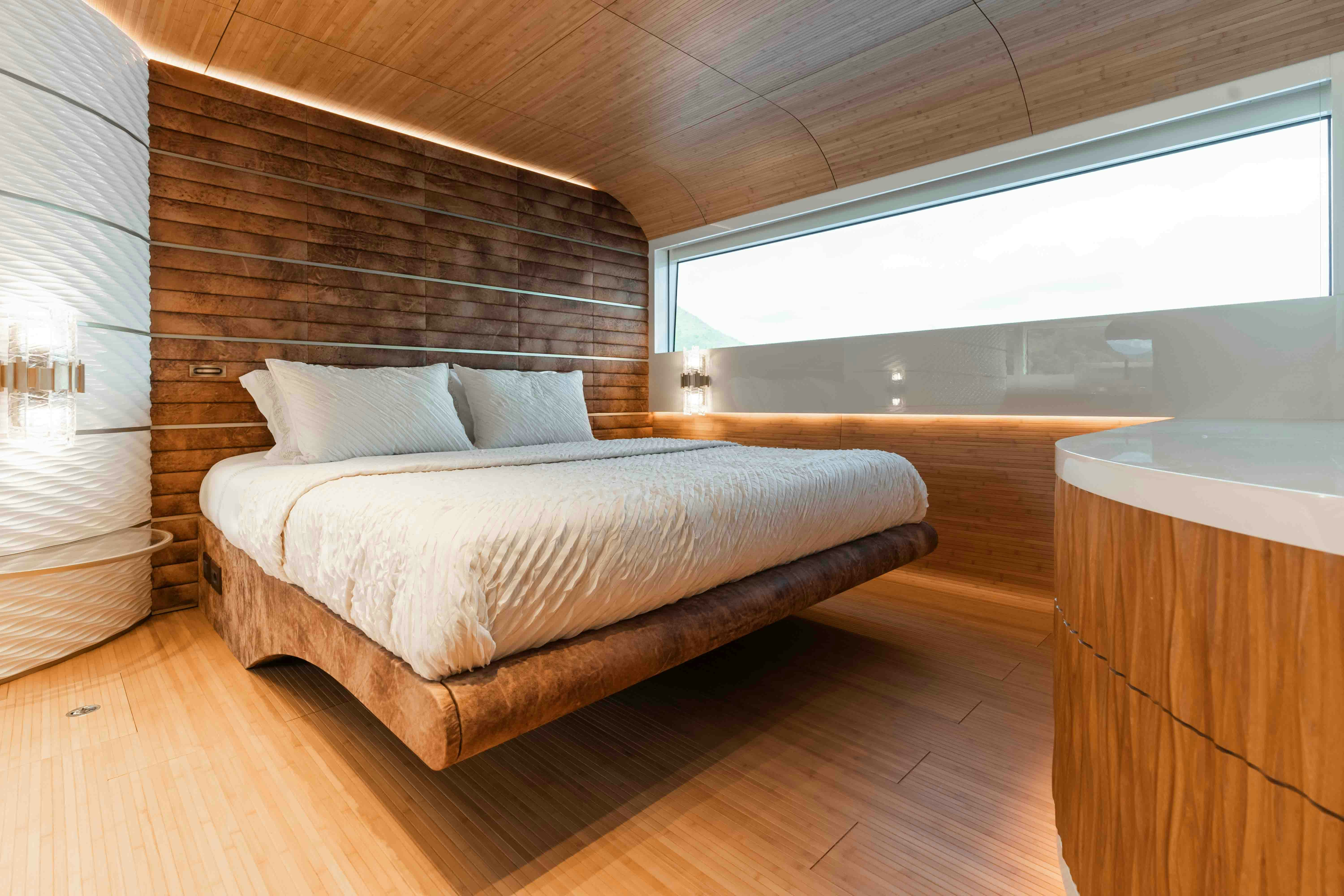 a bed in a room aboard NB 202 Yacht for Sale