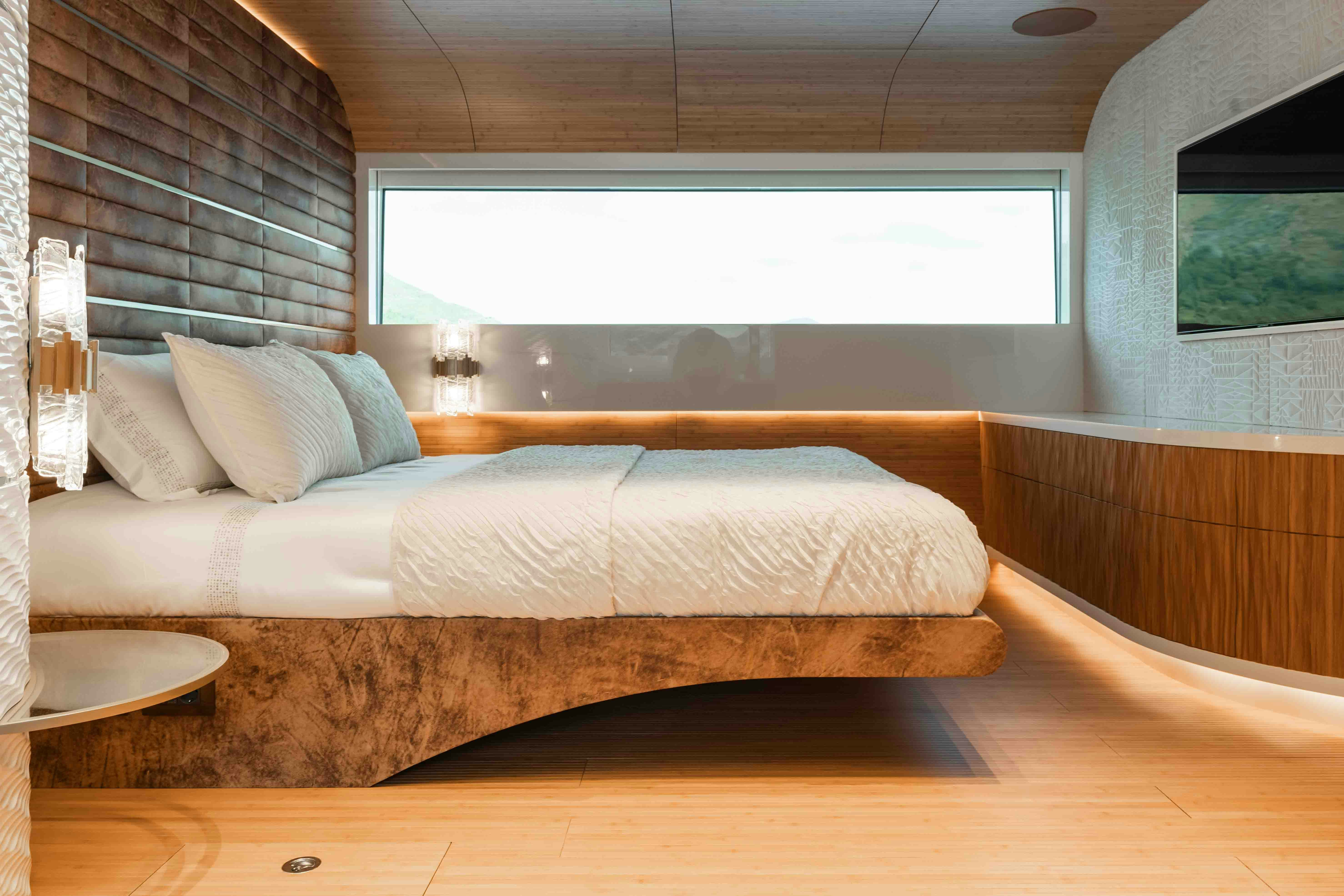 a bed in a room aboard NB 202 Yacht for Sale