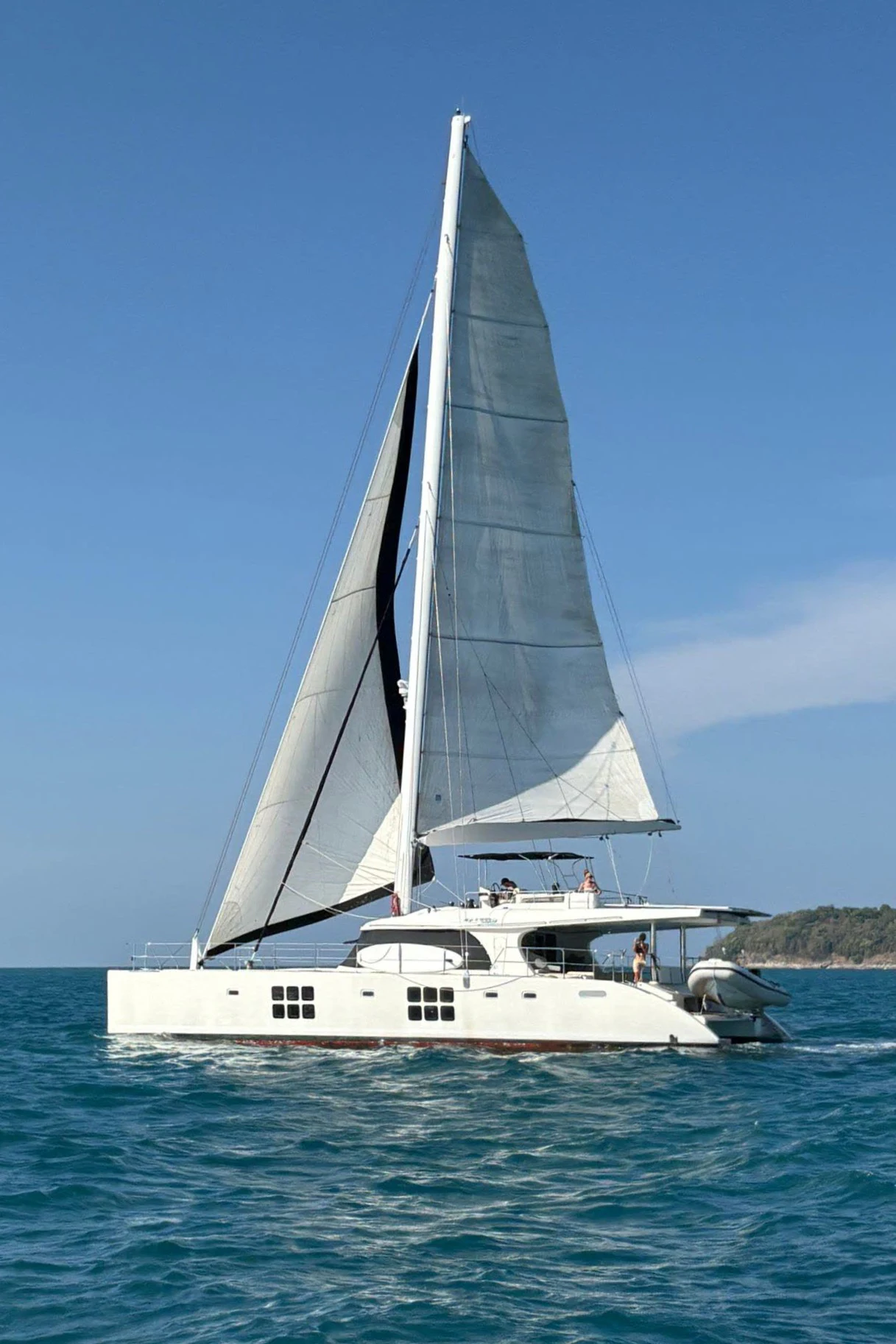 a sailboat on the water aboard OCEAN ESCAPE Yacht for Sale