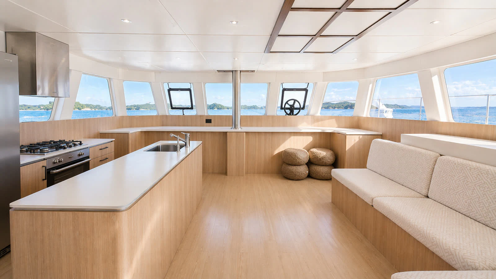 a kitchen with a couch and a table aboard OCEAN ESCAPE Yacht for Sale