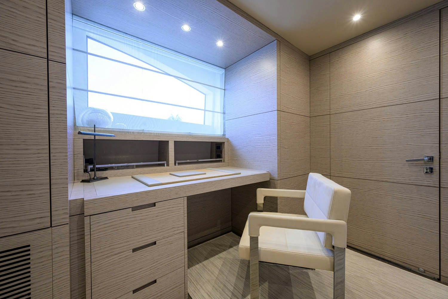 a room with a desk and a chair aboard COFINA Yacht for Charter