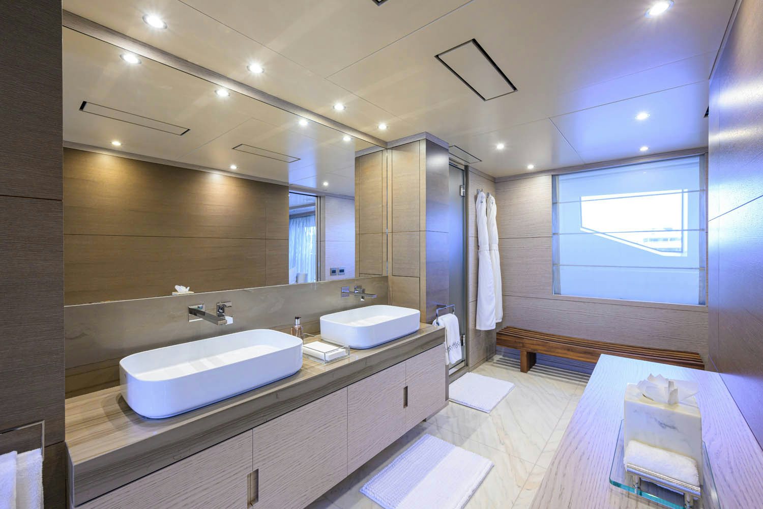 a bathroom with a large mirror aboard COFINA Yacht for Charter