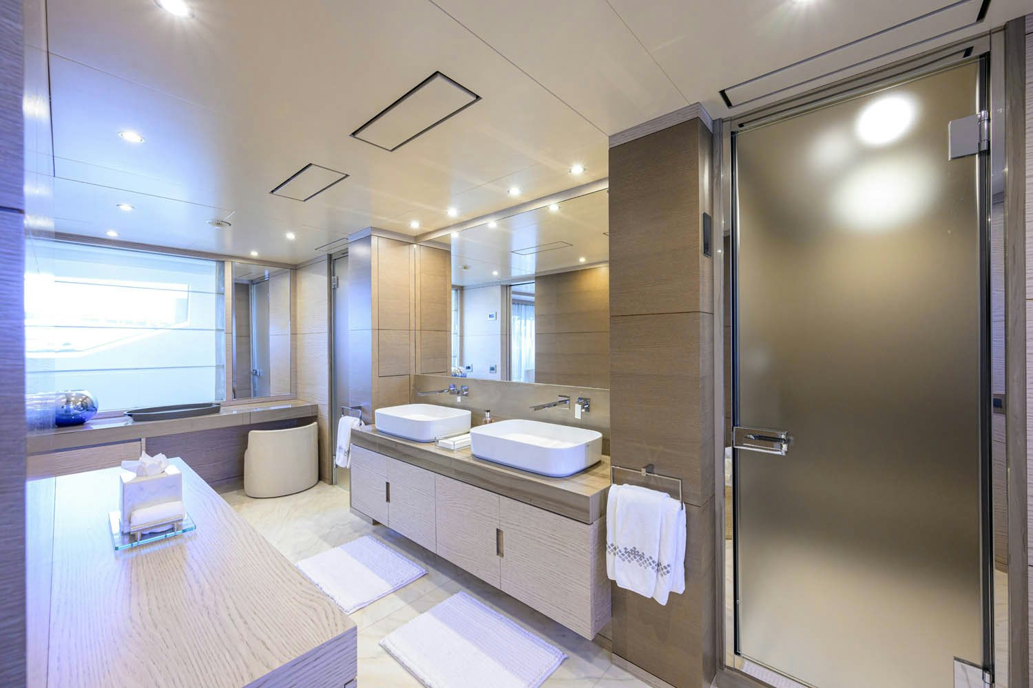 a bathroom with a large mirror aboard COFINA Yacht for Charter