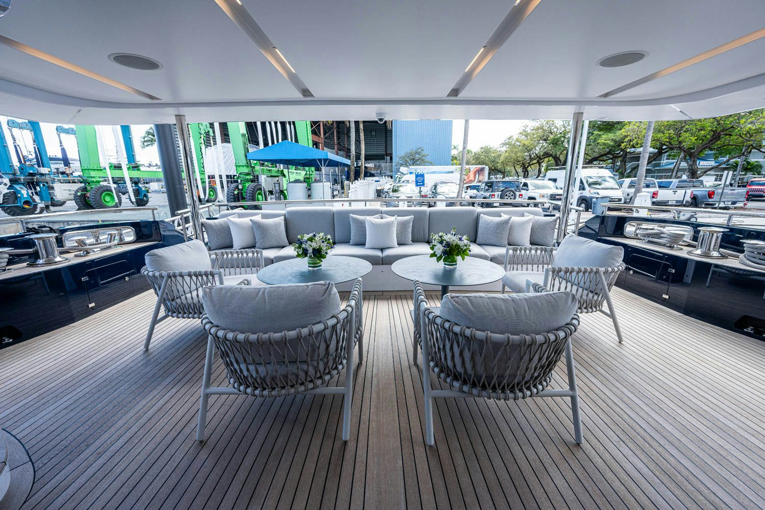 a large room with a table and chairs aboard COFINA Yacht for Charter