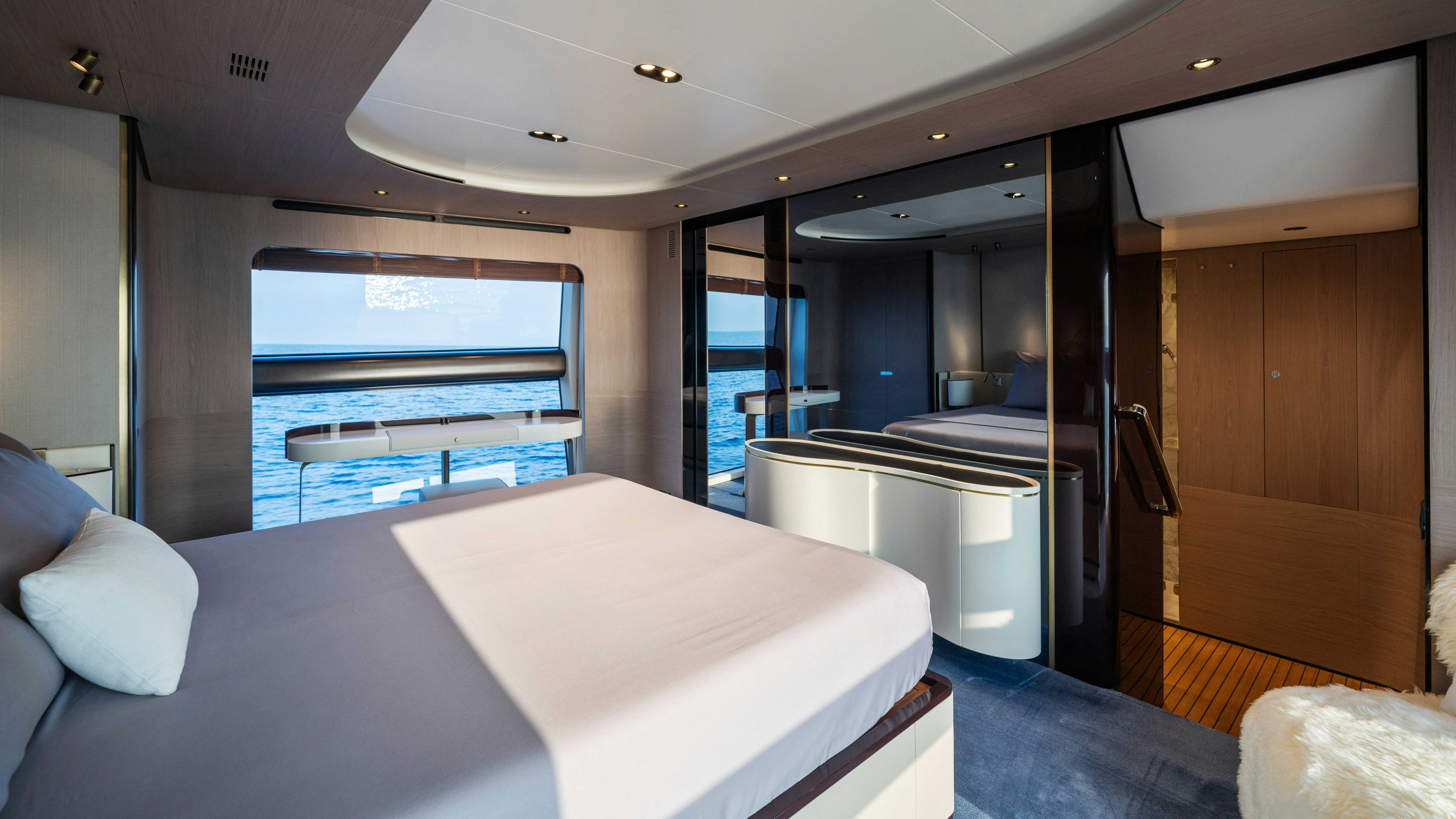 a room with a bed and a window aboard CHILLIN’ Yacht for Sale