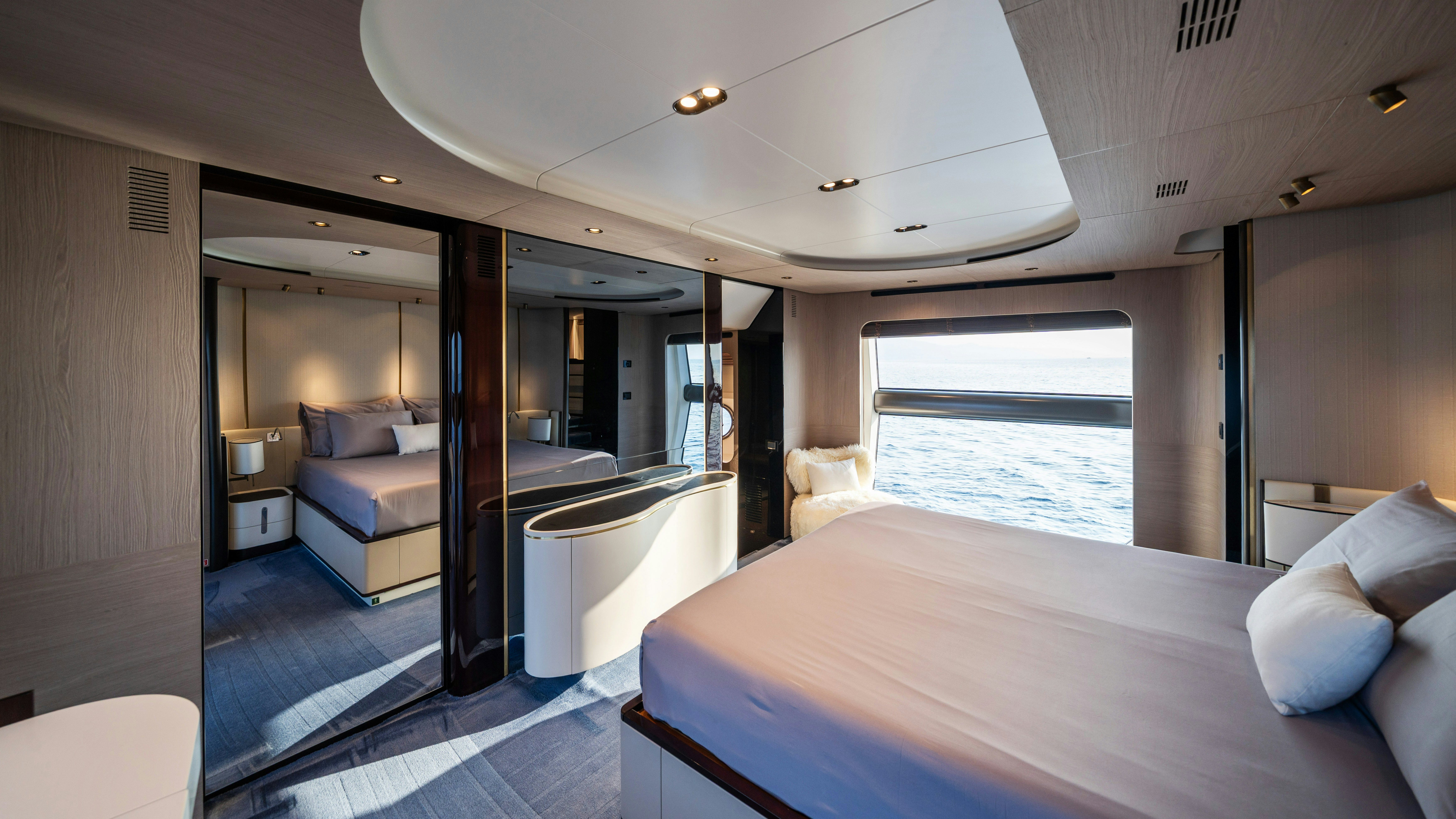 a room with a bed and a window aboard CHILLIN’ Yacht for Sale