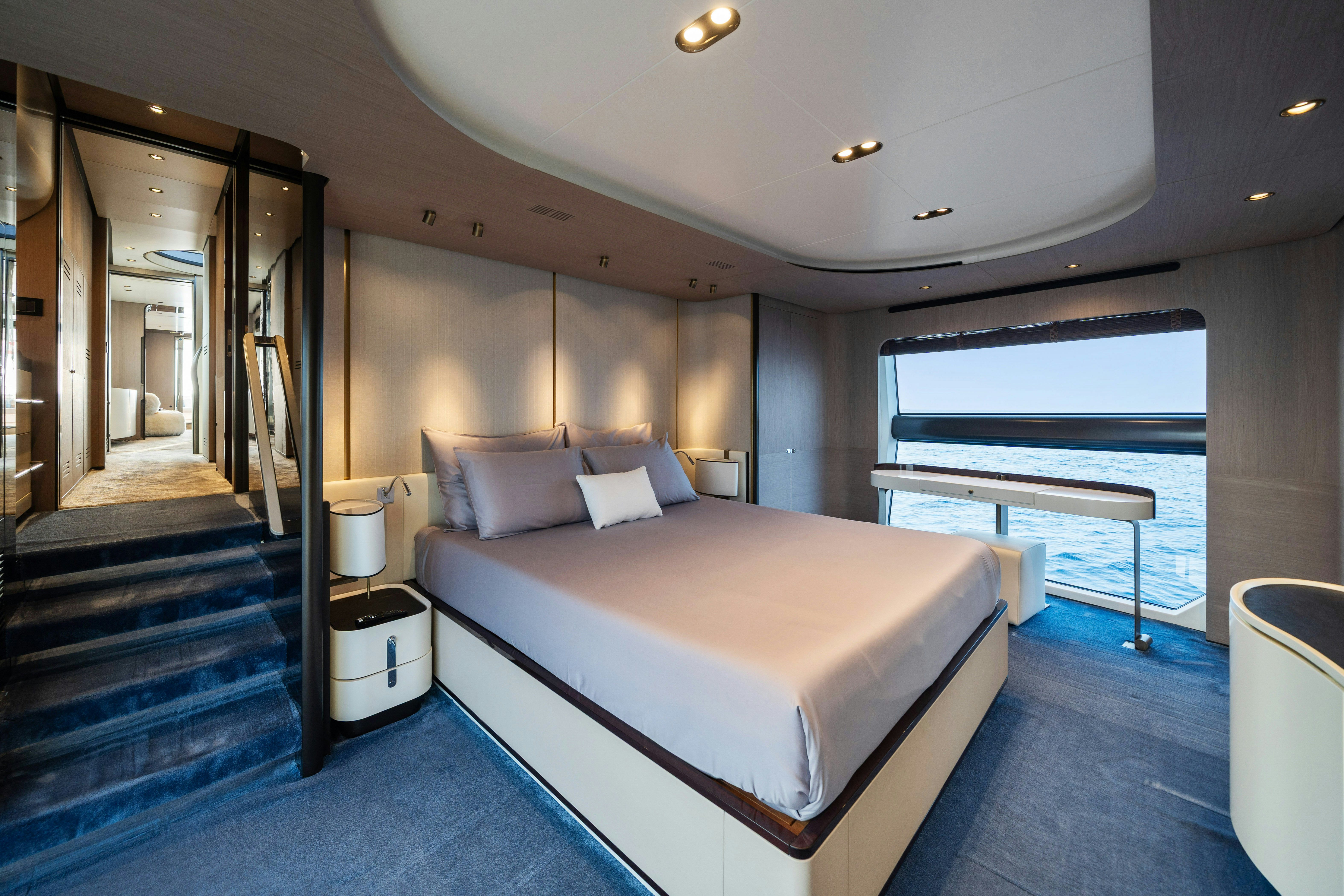 a room with a bed and a window aboard CHILLIN’ Yacht for Sale