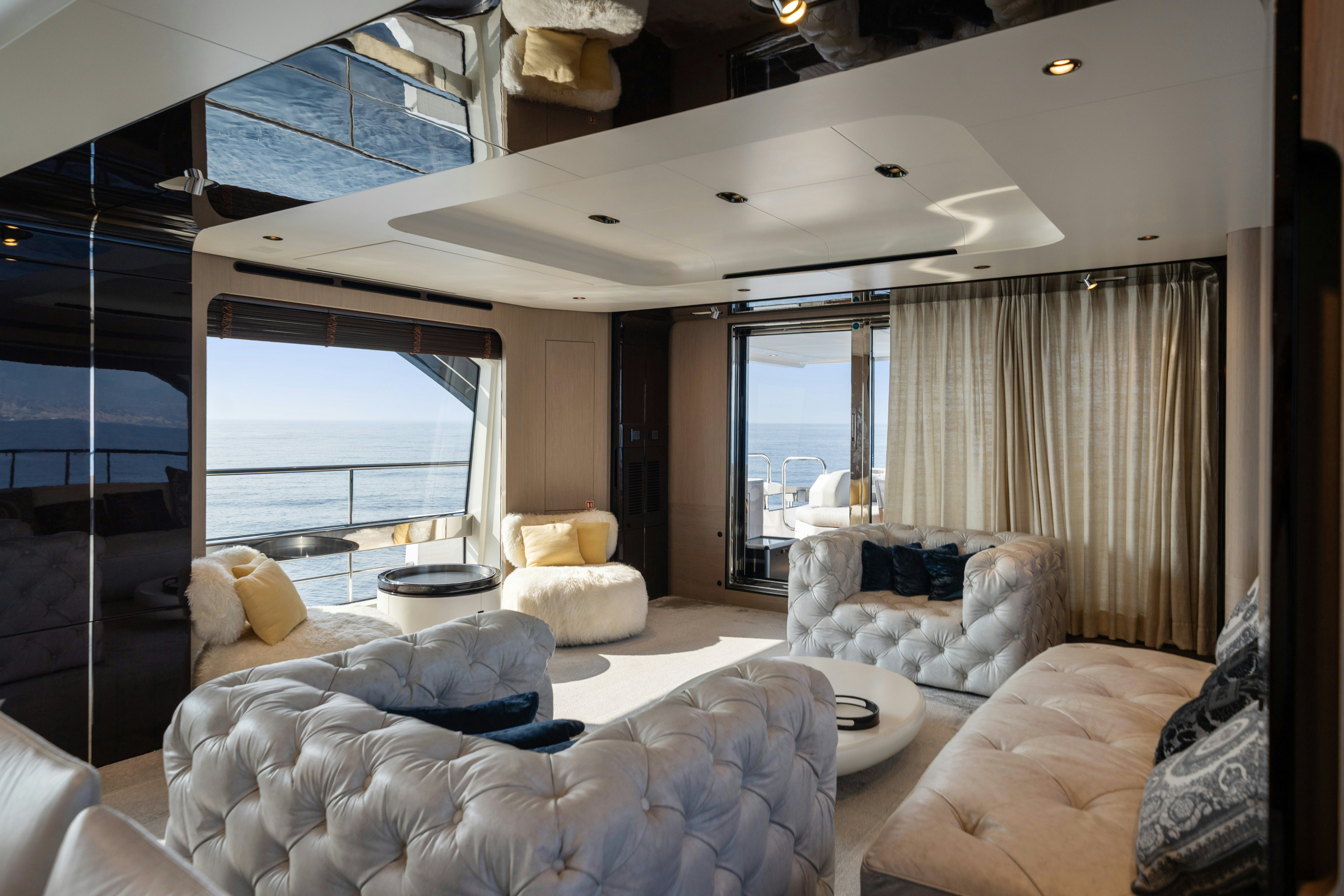 a living room with a large window aboard CHILLIN’ Yacht for Sale