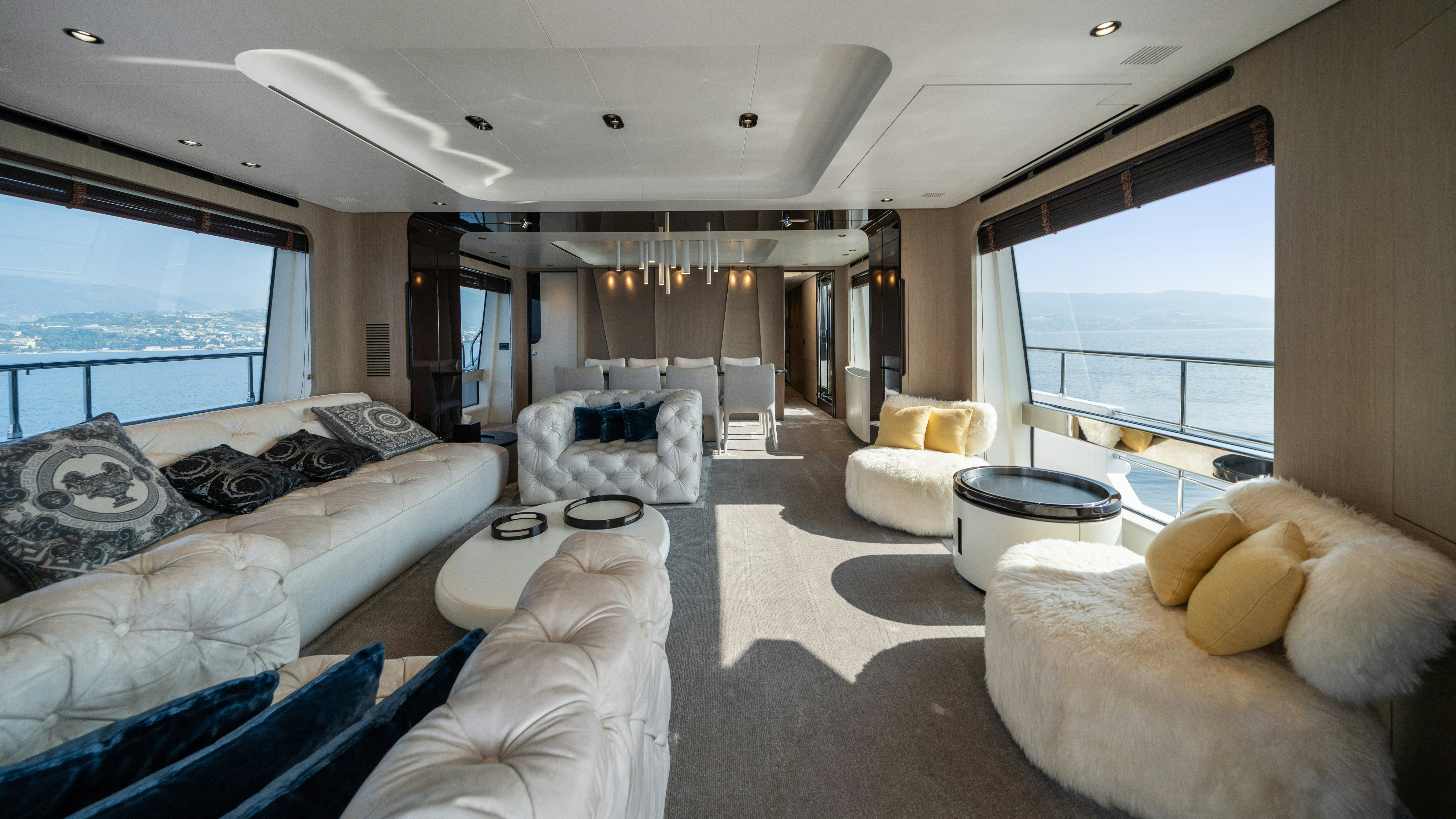 a living room with a large window aboard CHILLIN’ Yacht for Sale
