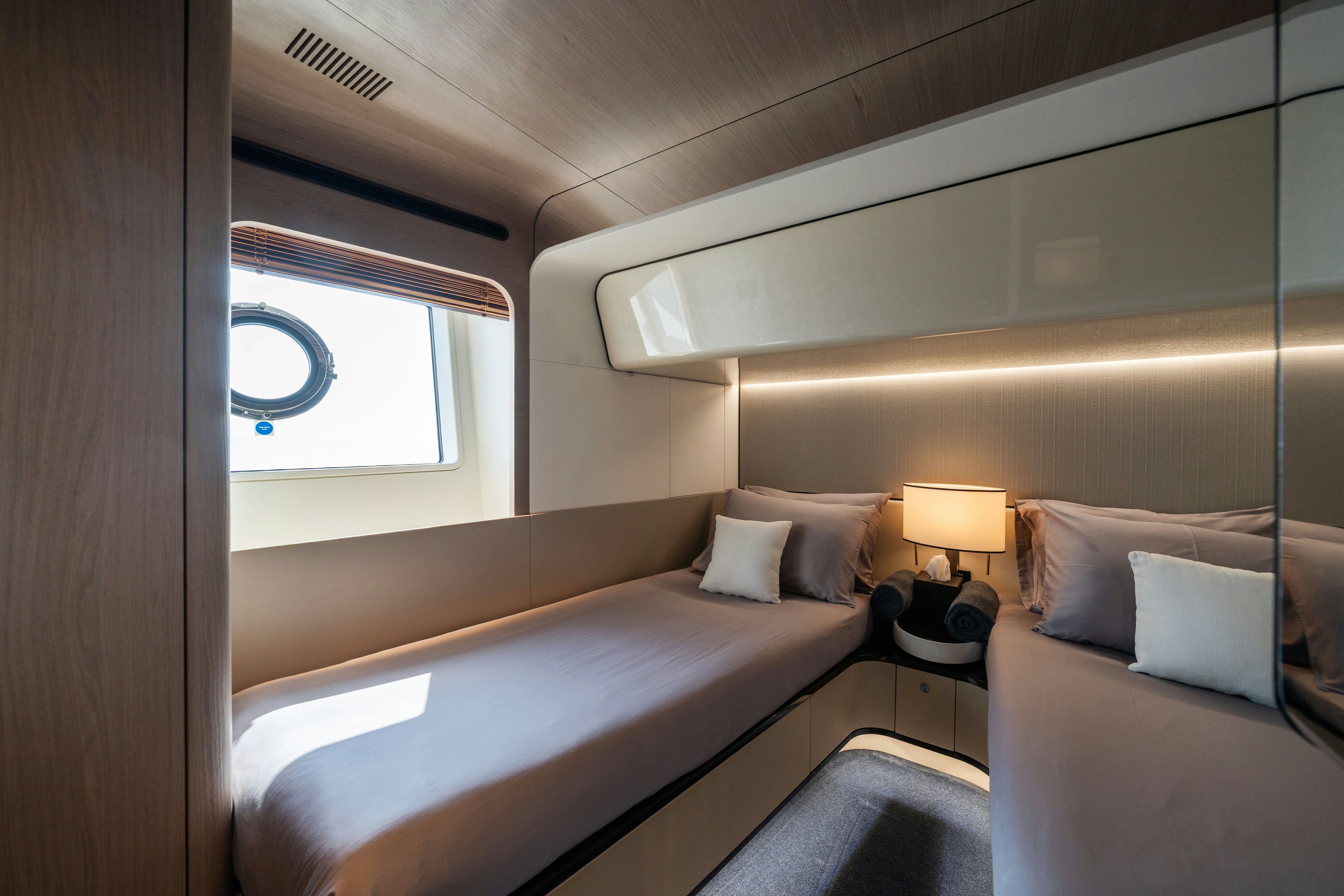 a room with two beds aboard CHILLIN’ Yacht for Sale