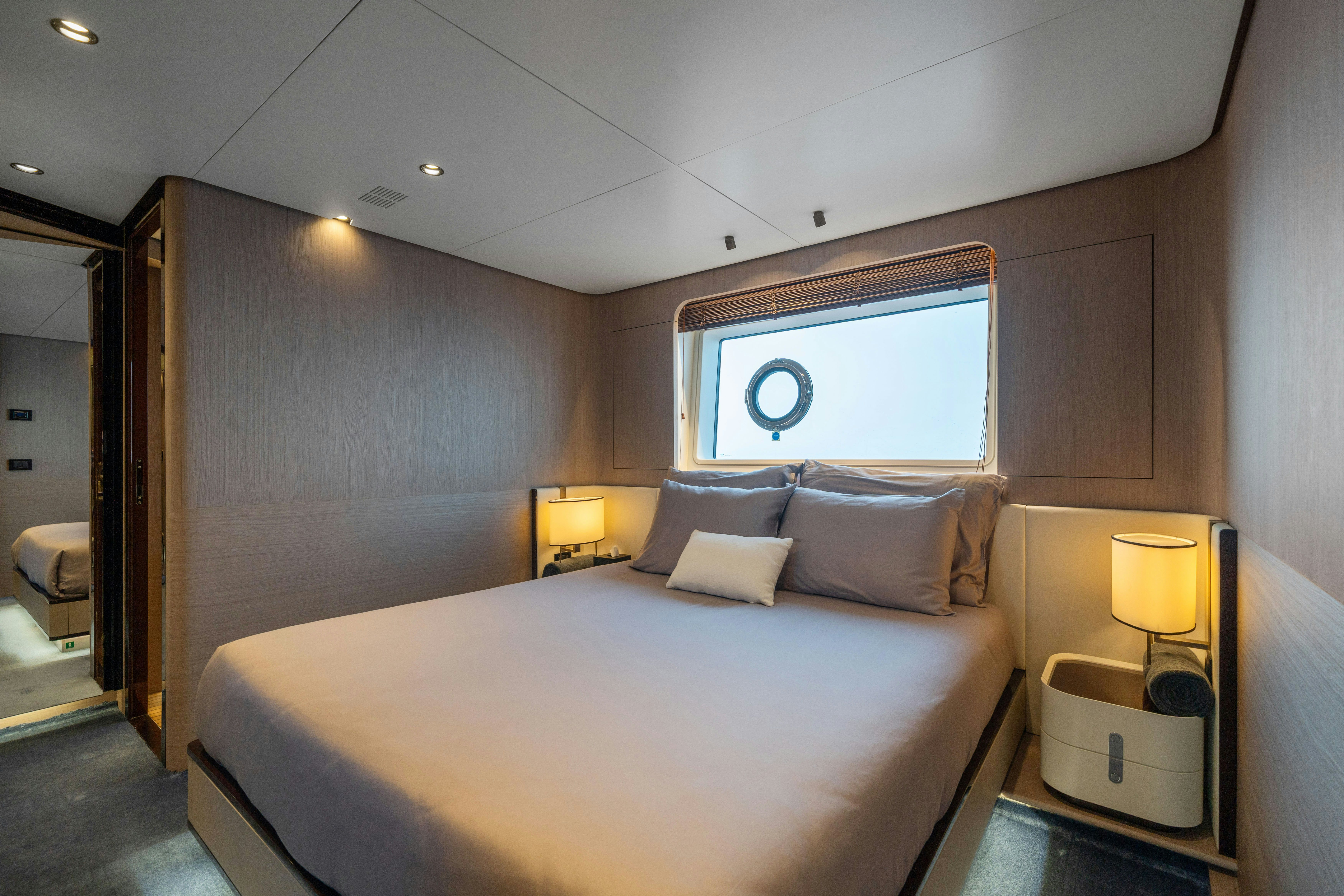 a bed in a room aboard CHILLIN’ Yacht for Sale