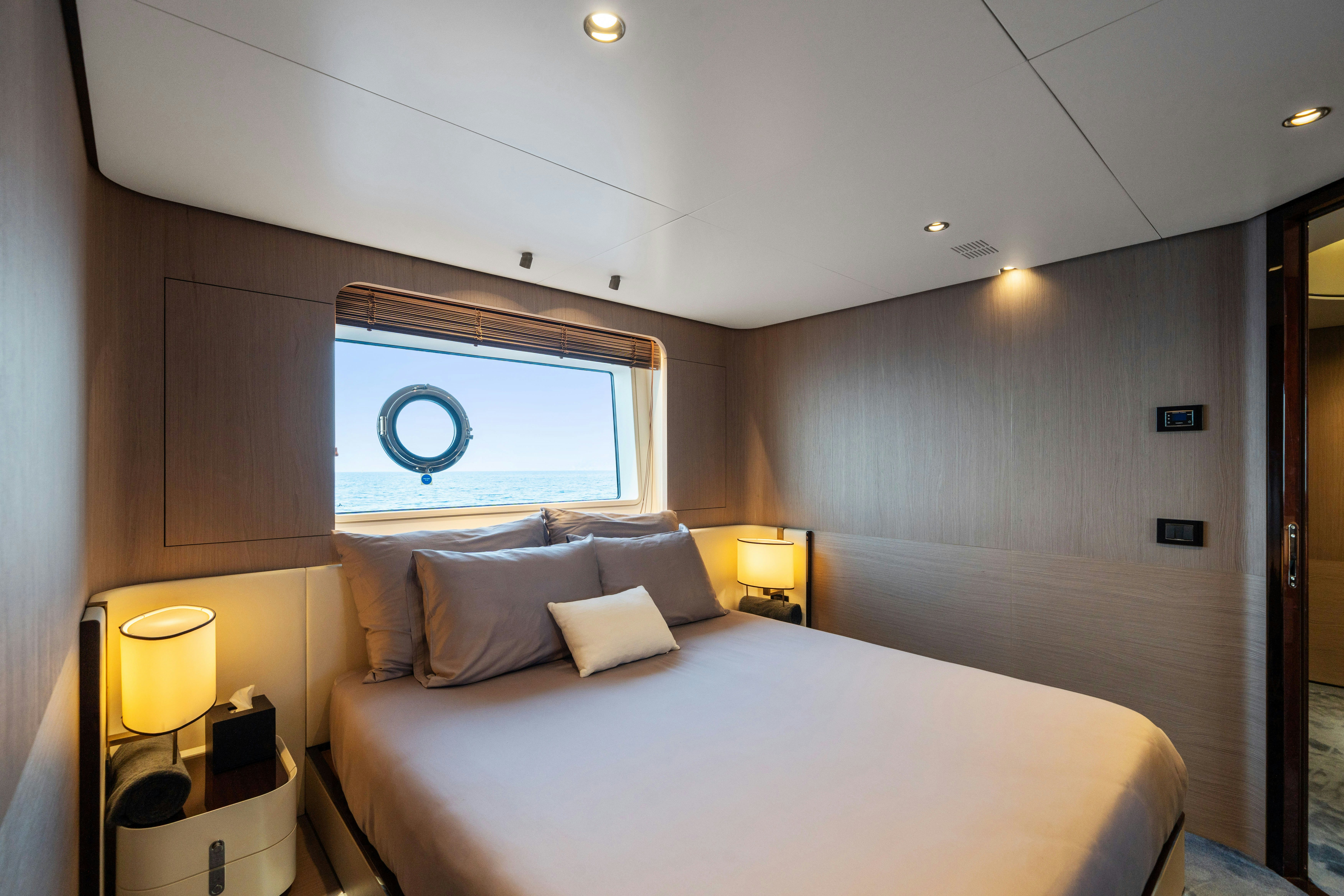 a bed in a room aboard CHILLIN’ Yacht for Sale