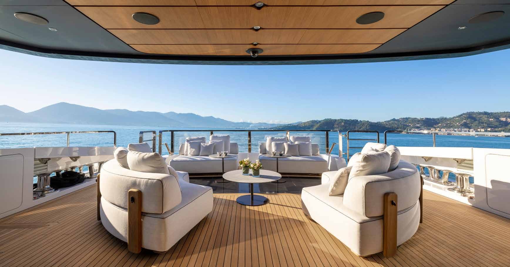a room with a couch and a table and a large body of water aboard MANGUSTA OCEANO 44/08 Yacht for Sale