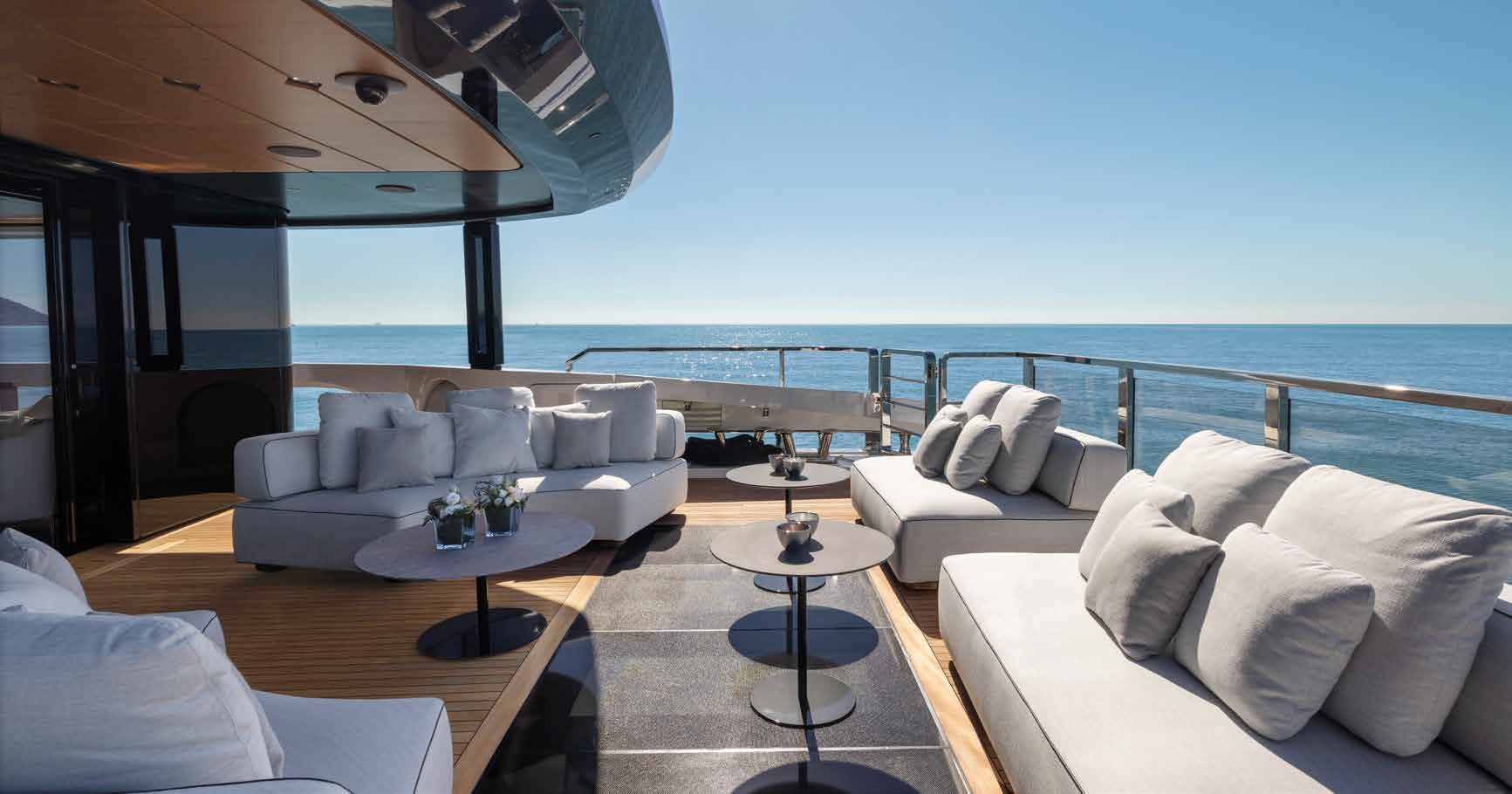 a living room with a large balcony aboard MANGUSTA OCEANO 44/08 Yacht for Sale