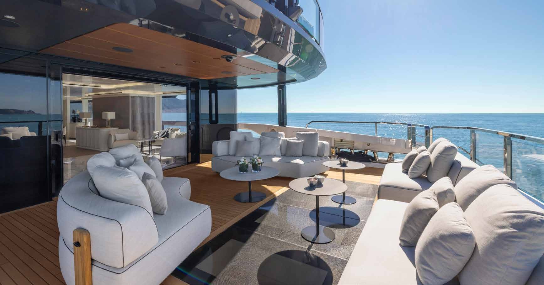 a living room with a large balcony aboard MANGUSTA OCEANO 44/08 Yacht for Sale