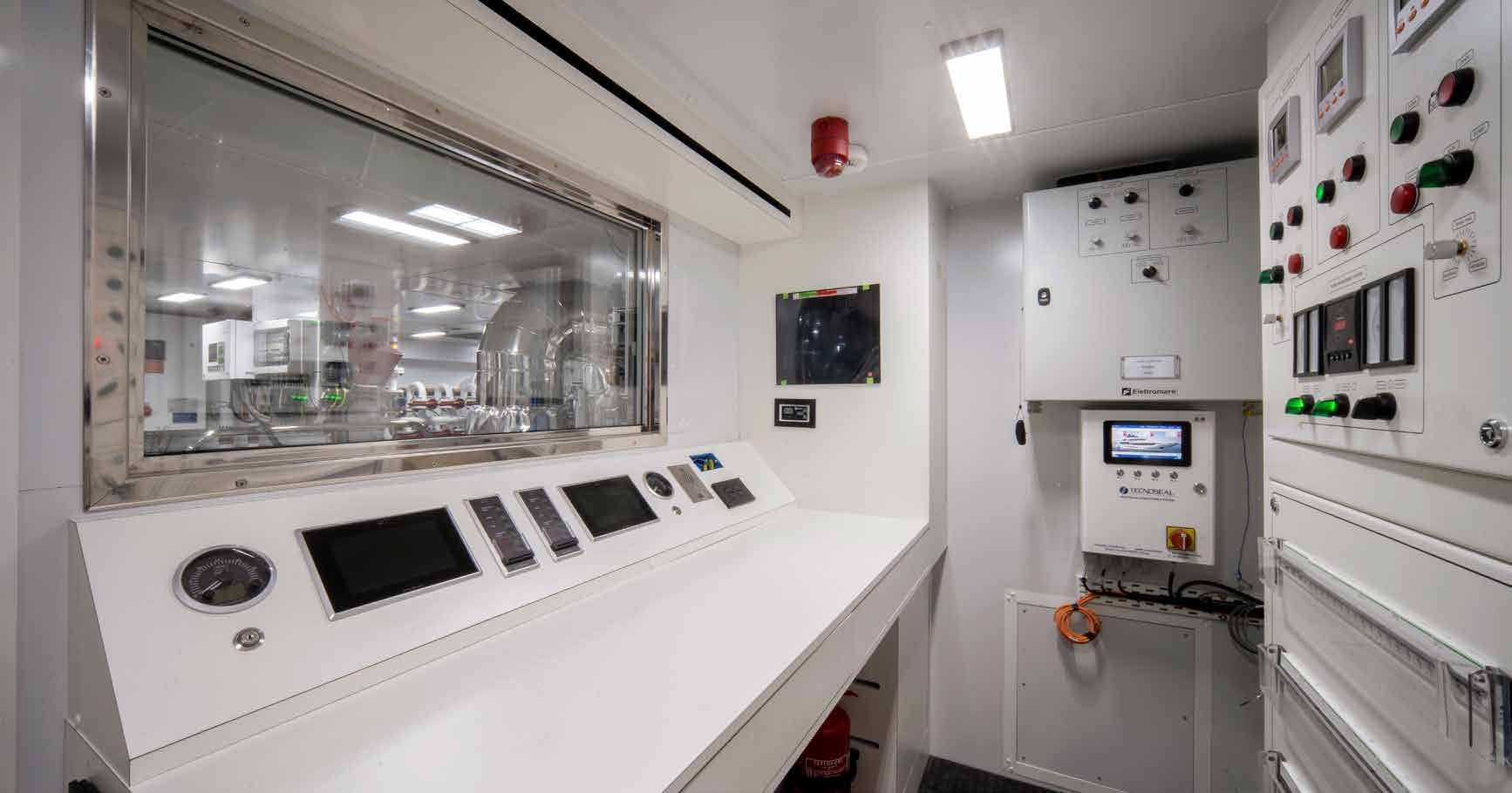 a kitchen with white cabinets aboard MANGUSTA OCEANO 44/08 Yacht for Sale