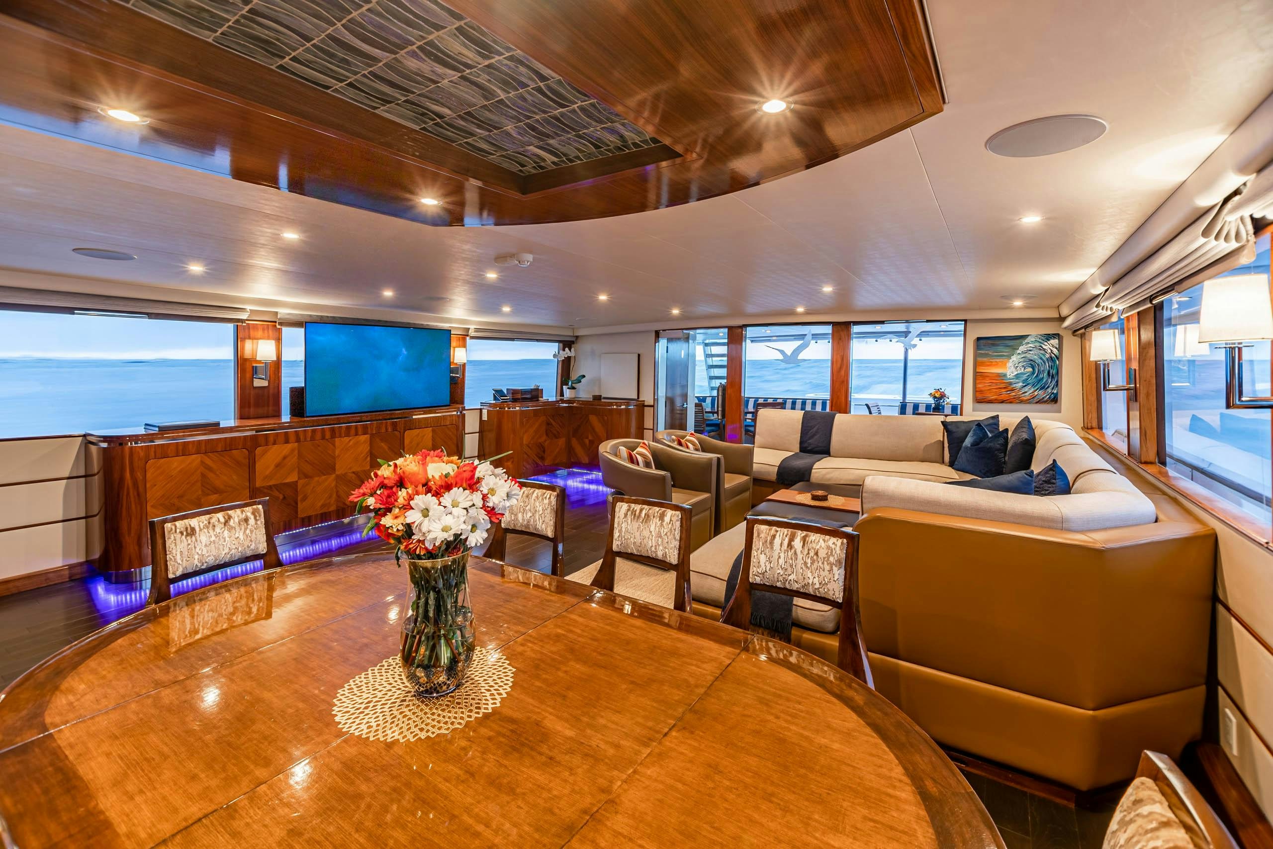 a living room with a large window aboard EL REY Yacht for Charter