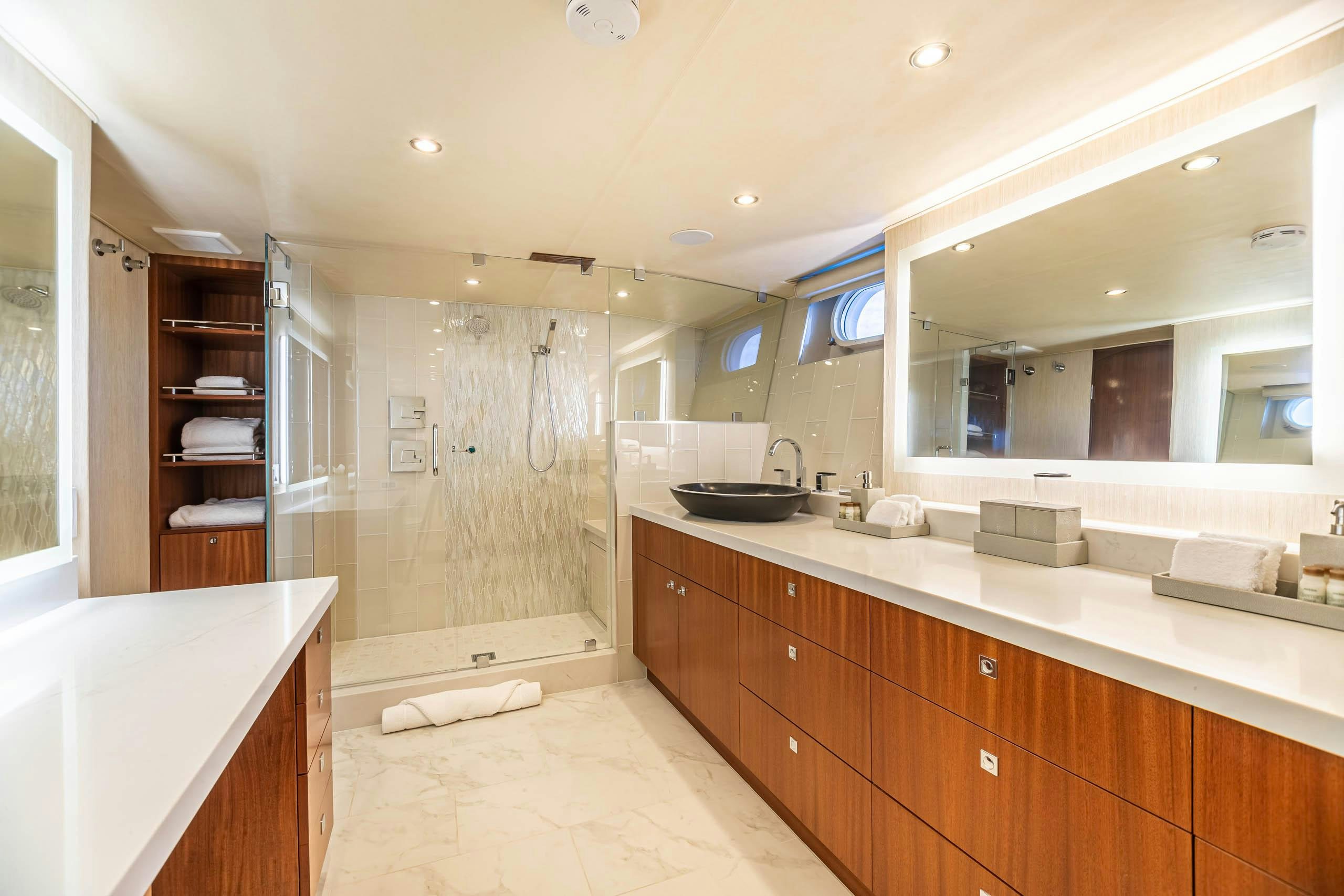 a bathroom with a large mirror aboard EL REY Yacht for Charter