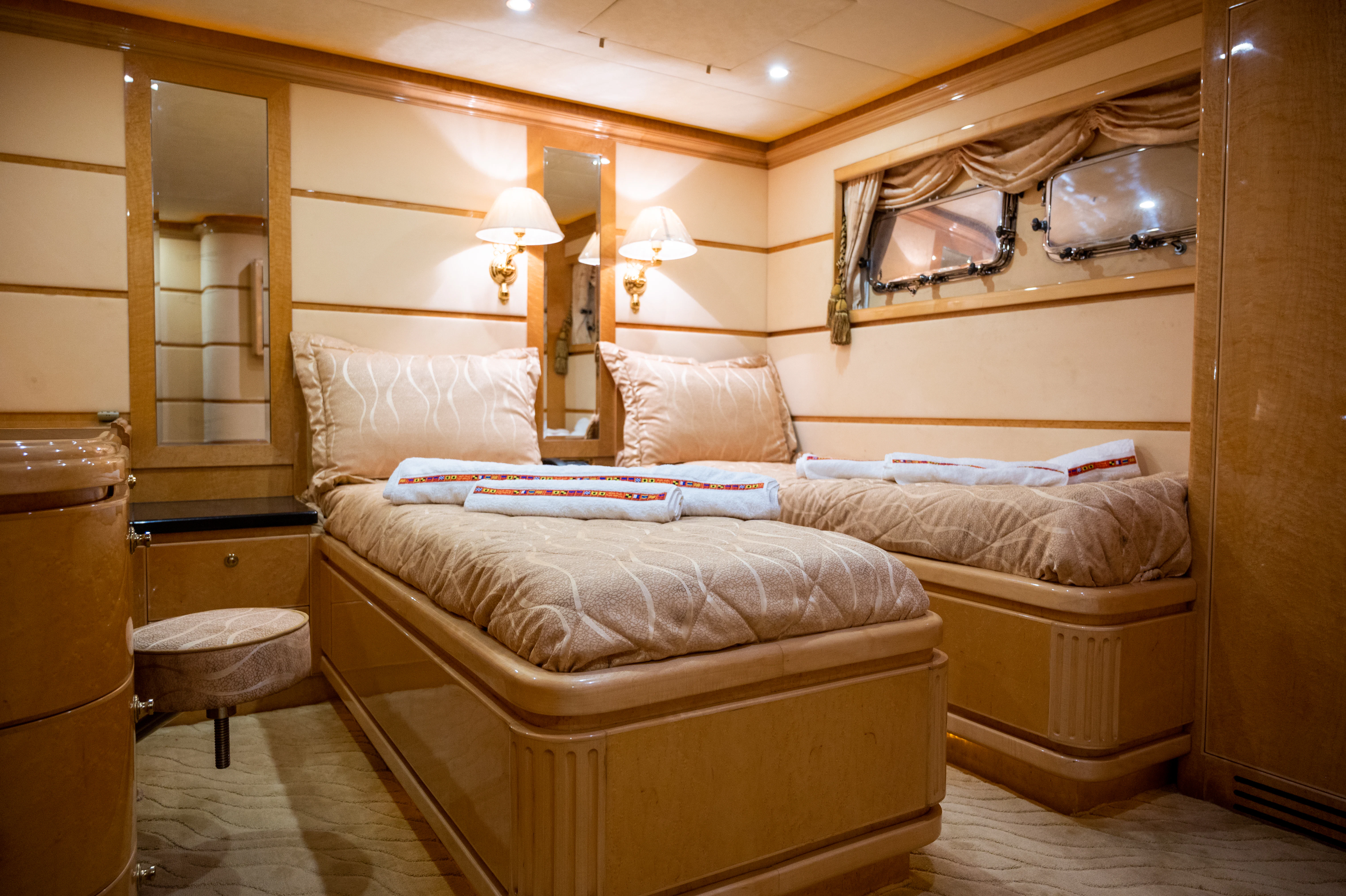 a bed in a room aboard LADY EILEEN II Yacht for Sale