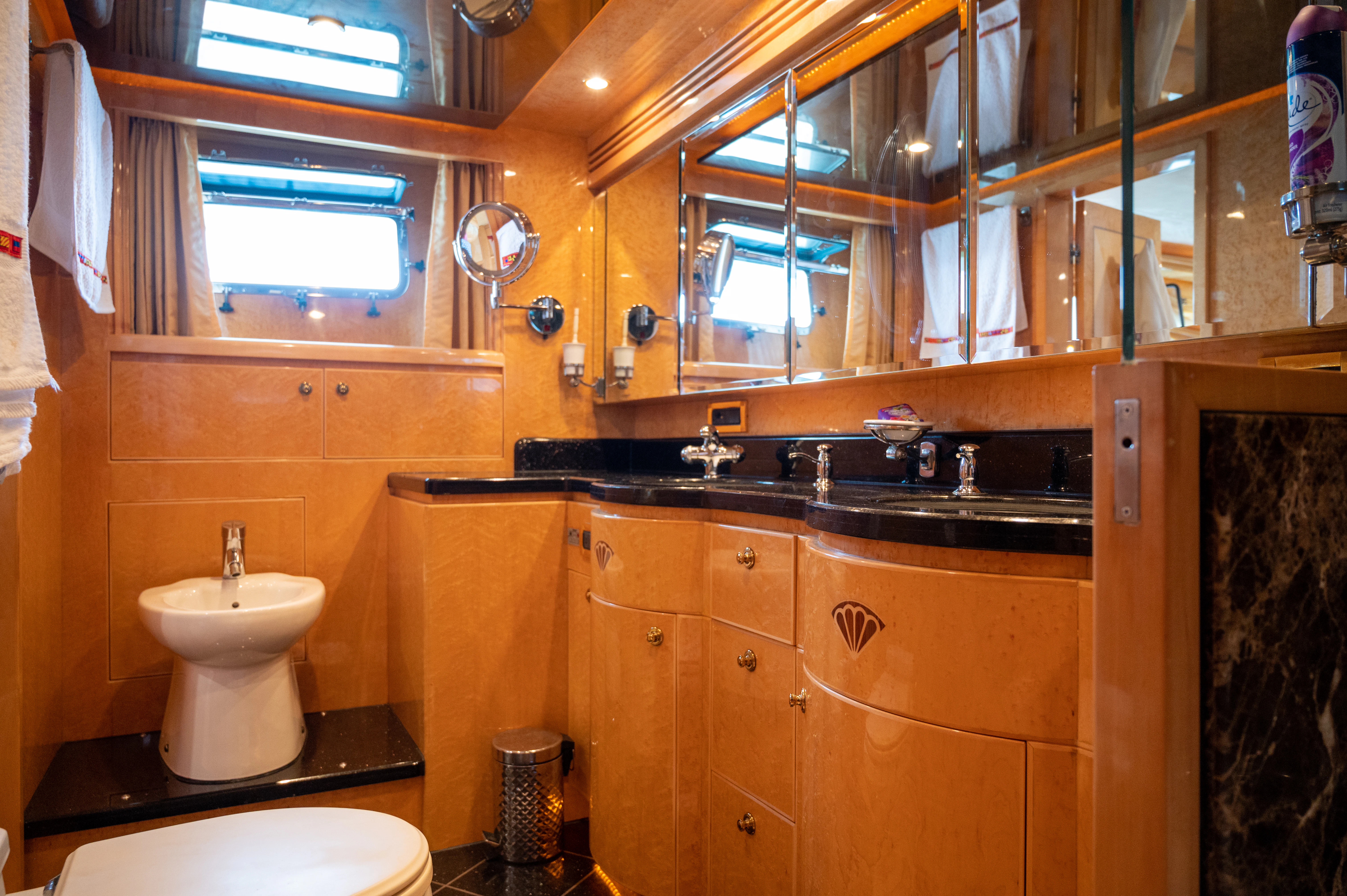 a bathroom with a sink and a mirror aboard LADY EILEEN II Yacht for Sale