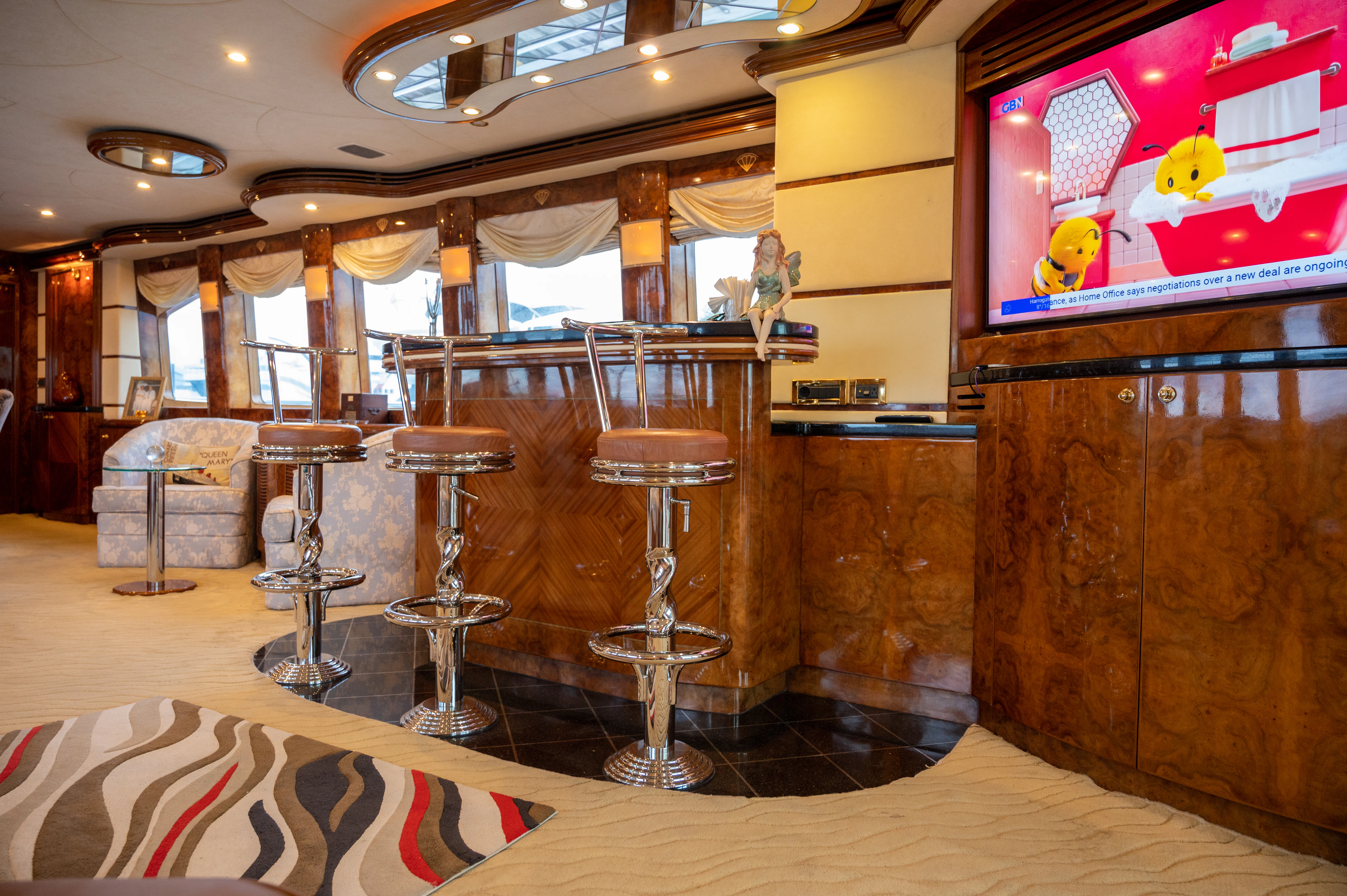 a room with a table and chairs aboard LADY EILEEN II Yacht for Sale