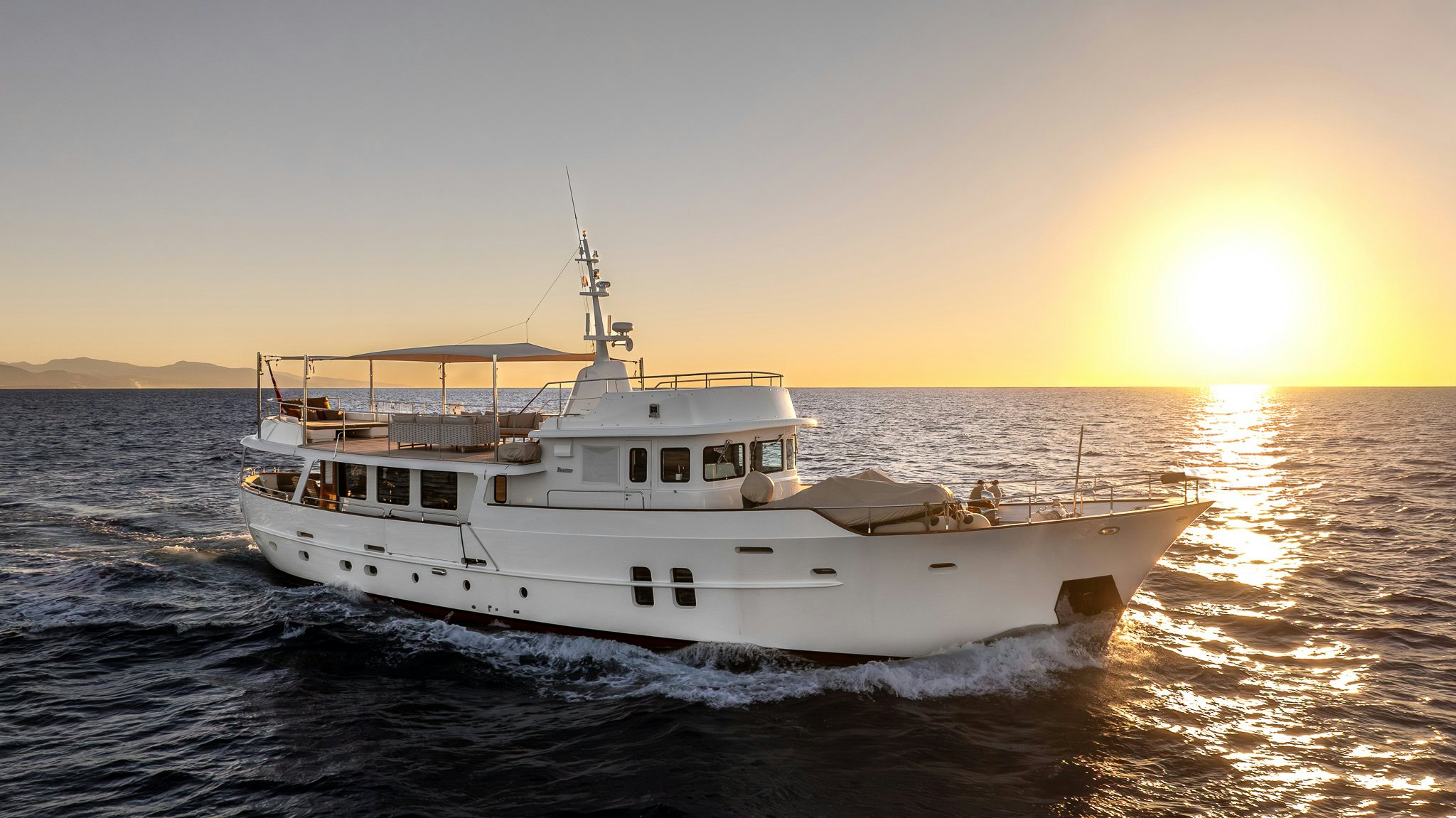 a white boat in the water aboard SULTANA Yacht for Sale