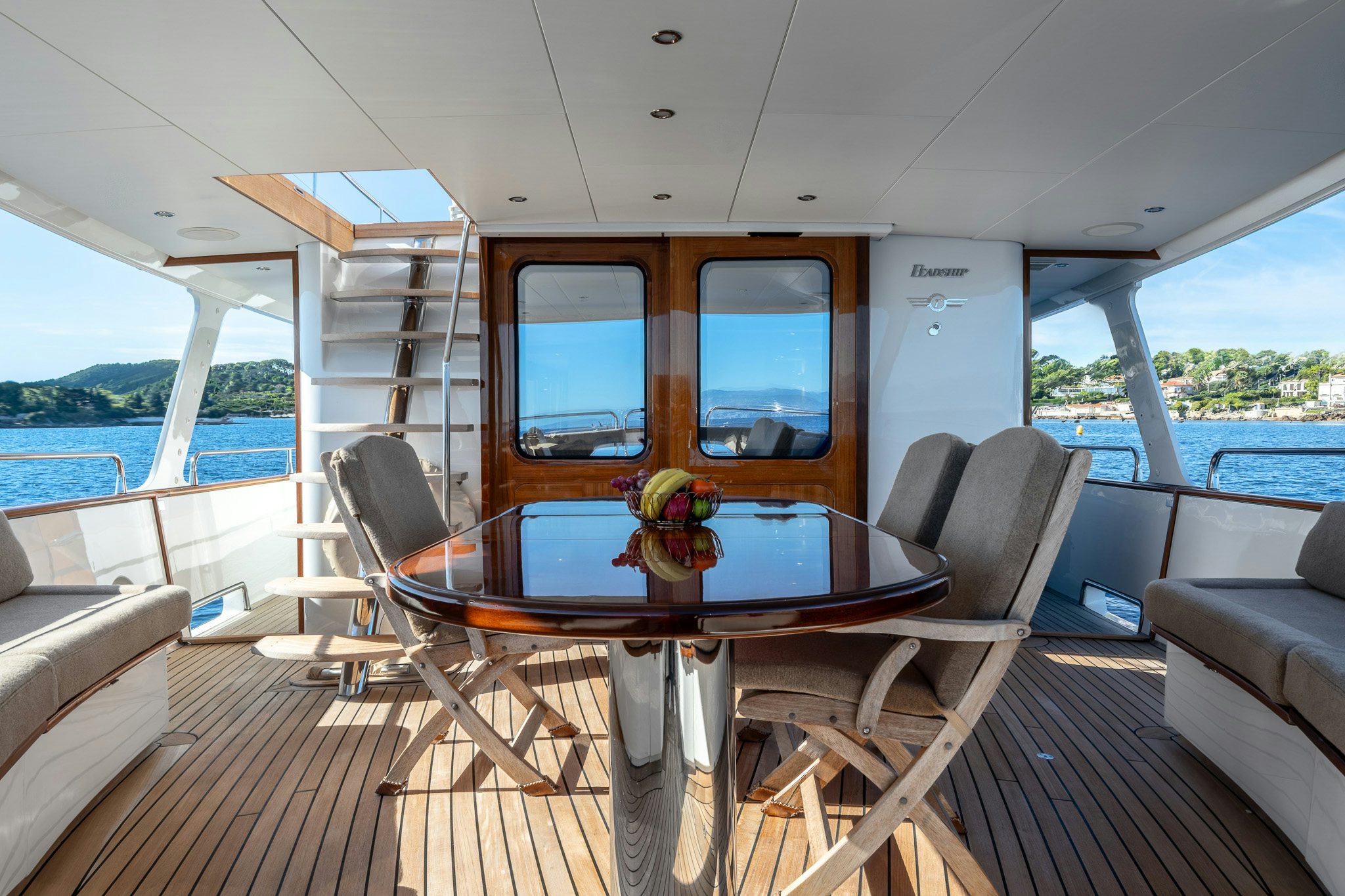 a boat with a table and chairs aboard SULTANA Yacht for Sale