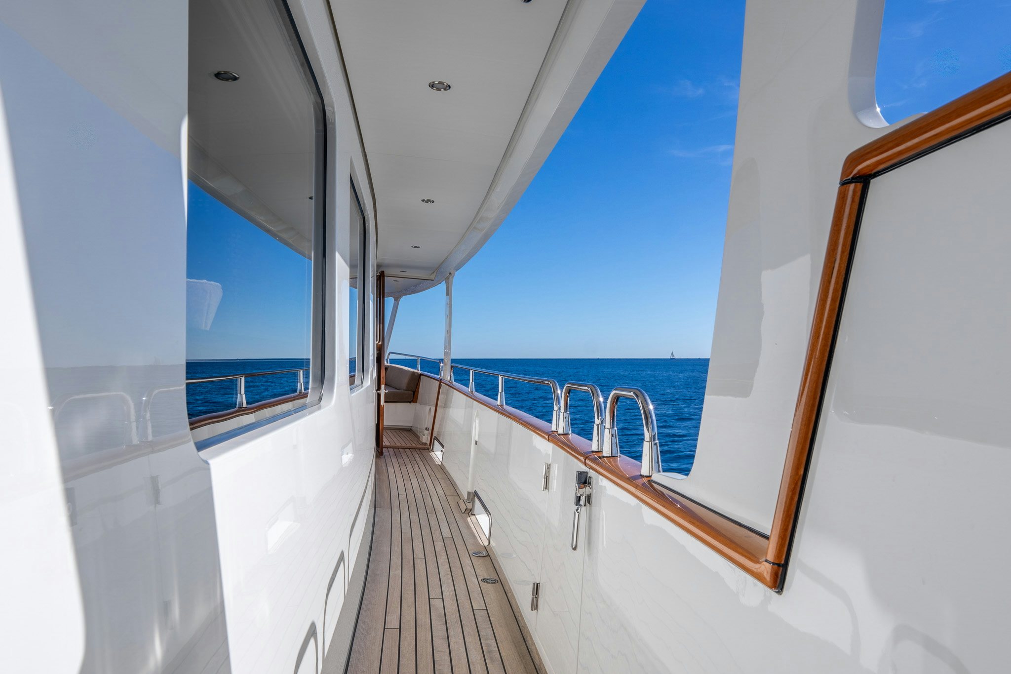 a long hallway with a view of the ocean aboard SULTANA Yacht for Sale
