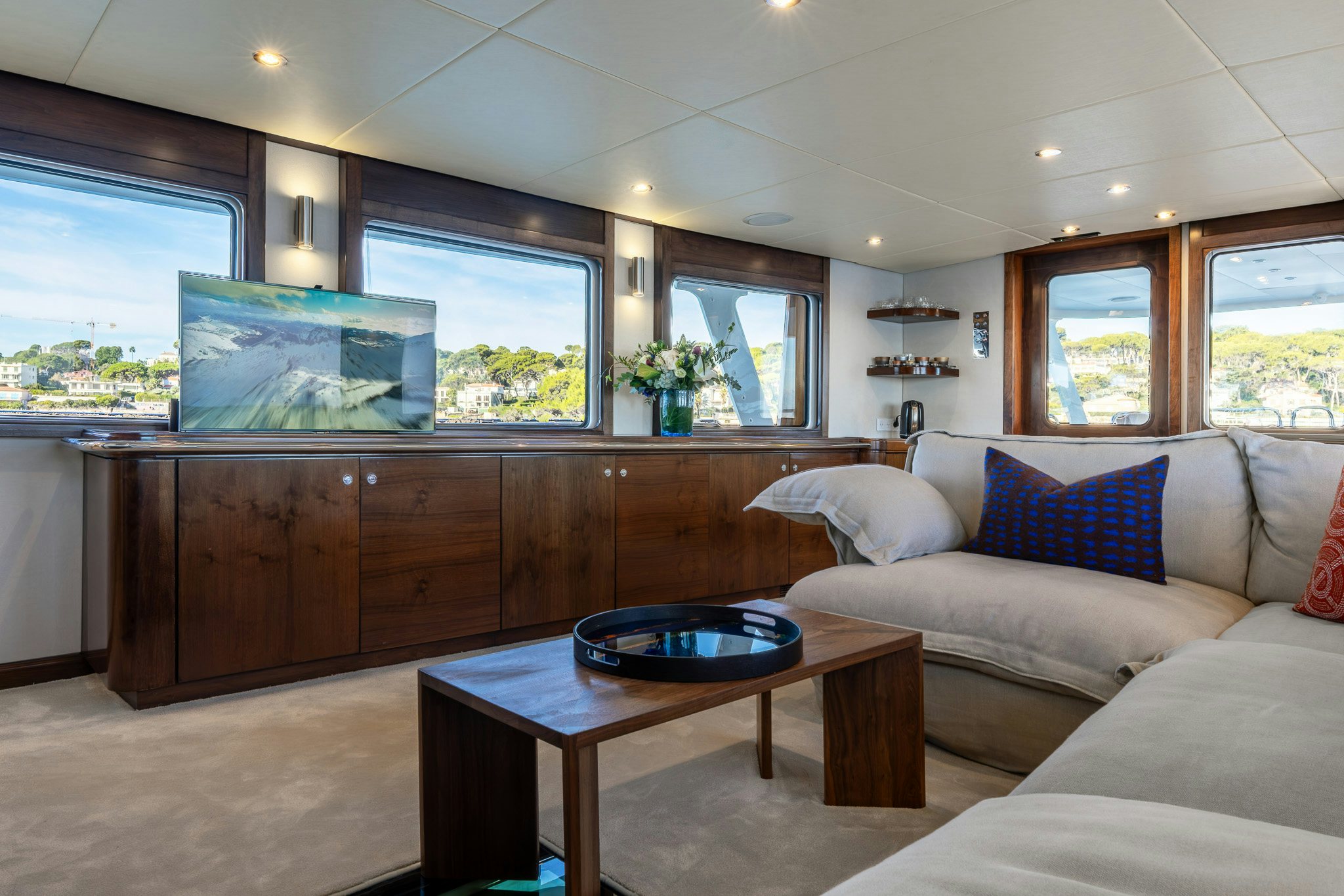 a living room with a large tv aboard SULTANA Yacht for Sale