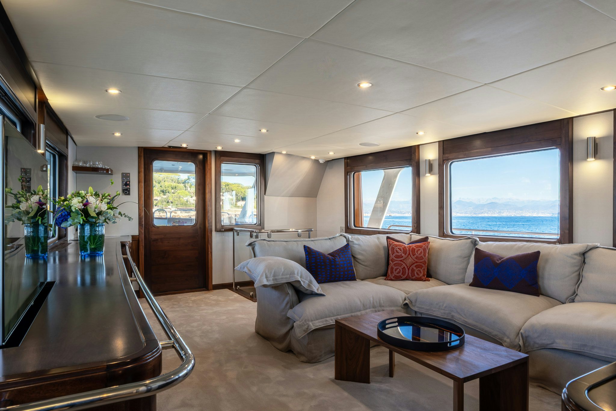 a living room with a couch and a coffee table aboard SULTANA Yacht for Sale