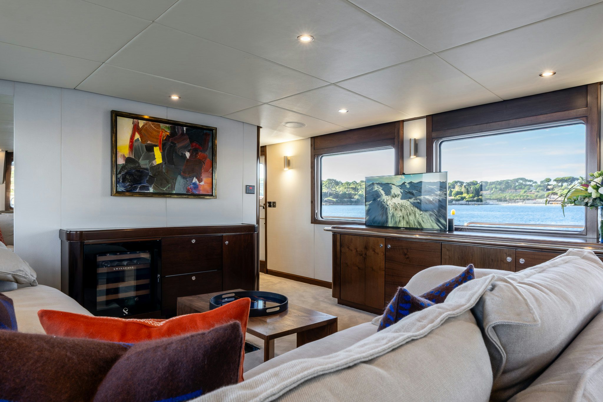 a living room with a large window aboard SULTANA Yacht for Sale