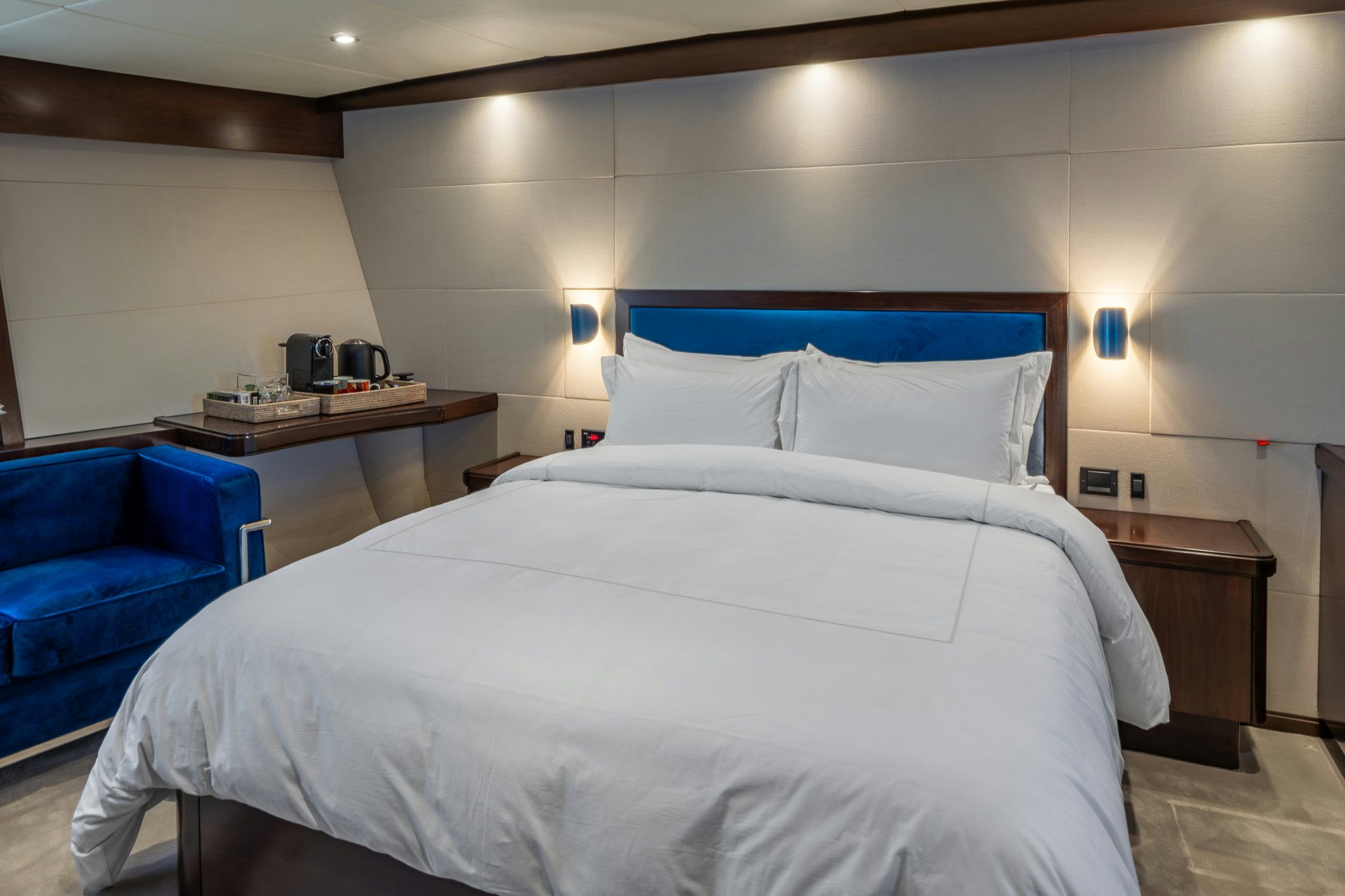 a bed with white sheets aboard SULTANA Yacht for Sale
