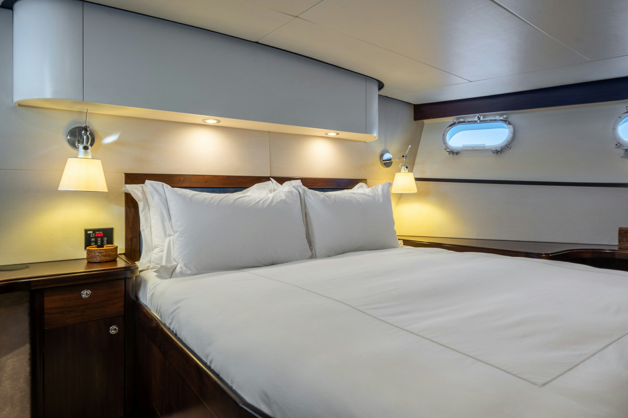 a bed with white sheets aboard SULTANA Yacht for Sale