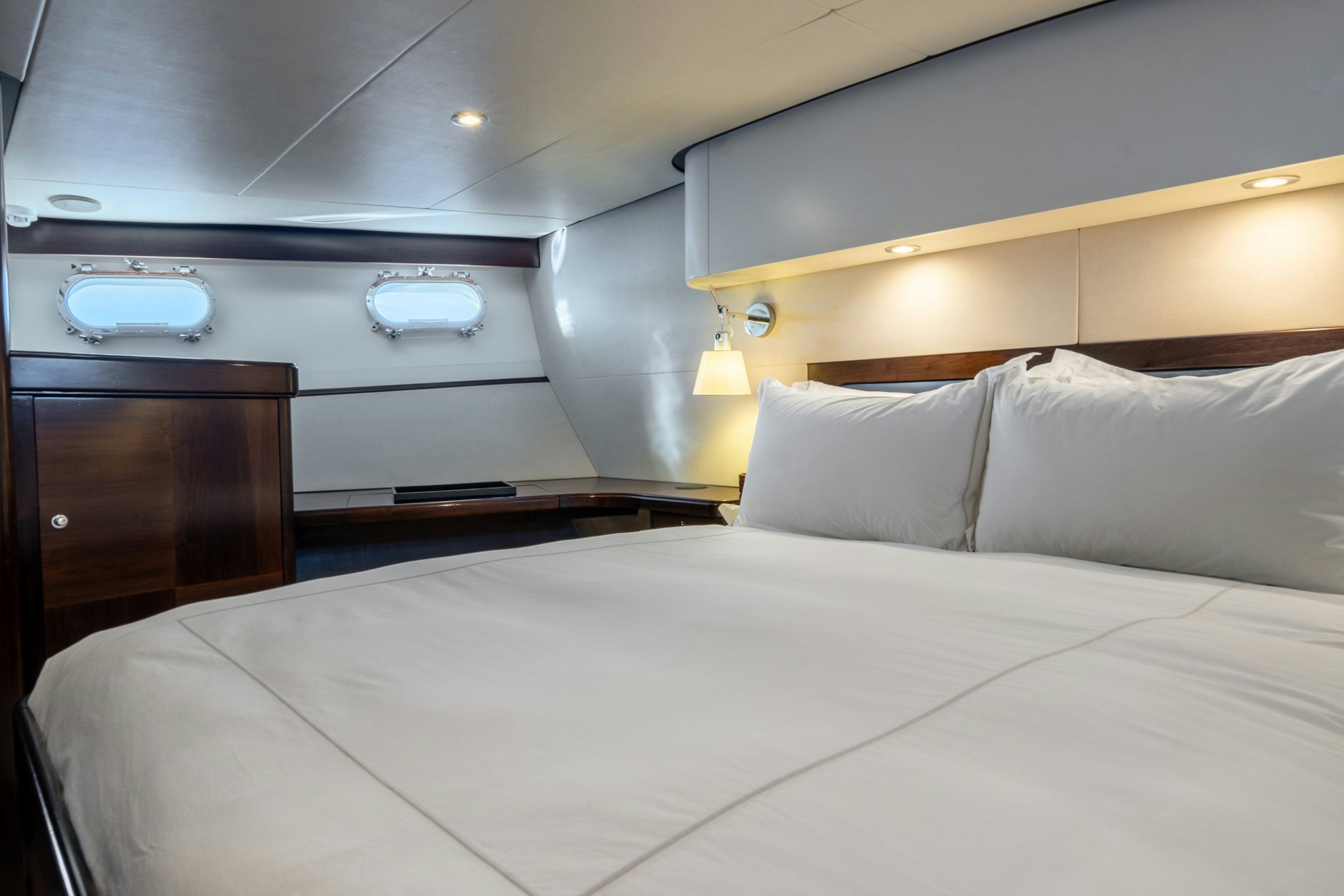 a bed with white sheets aboard SULTANA Yacht for Sale