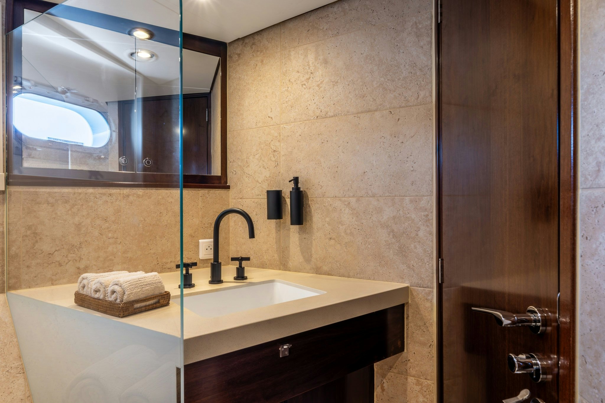 a bathroom with a sink and a mirror aboard SULTANA Yacht for Sale
