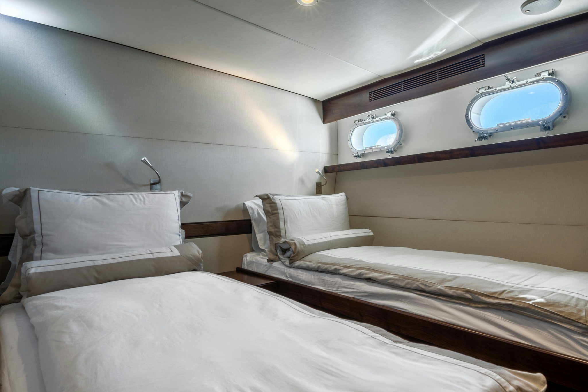 a room with two beds aboard SULTANA Yacht for Sale