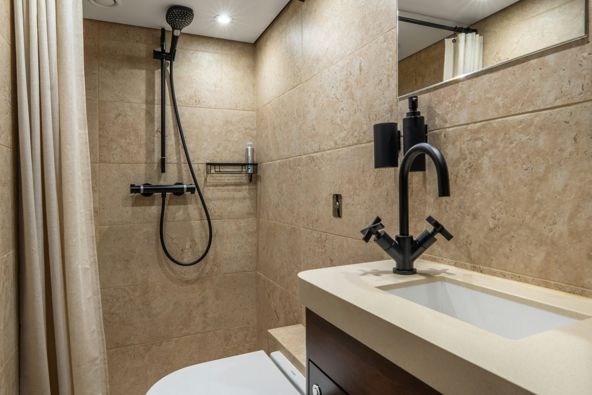 a bathroom with a shower and sink aboard SULTANA Yacht for Sale