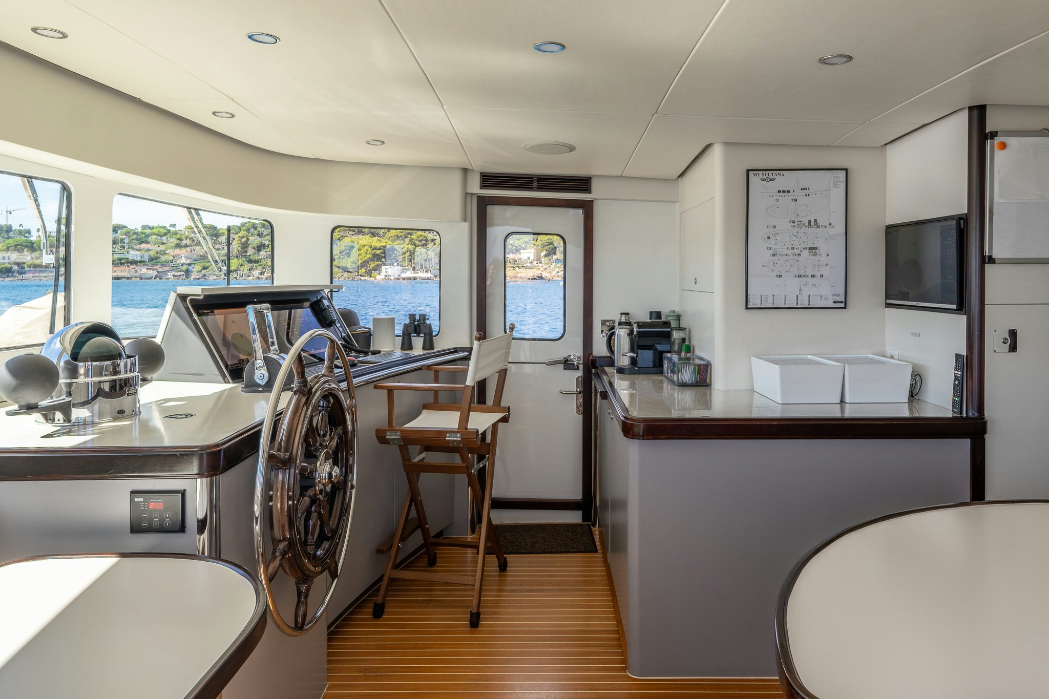a kitchen with a bar and a bar aboard SULTANA Yacht for Sale