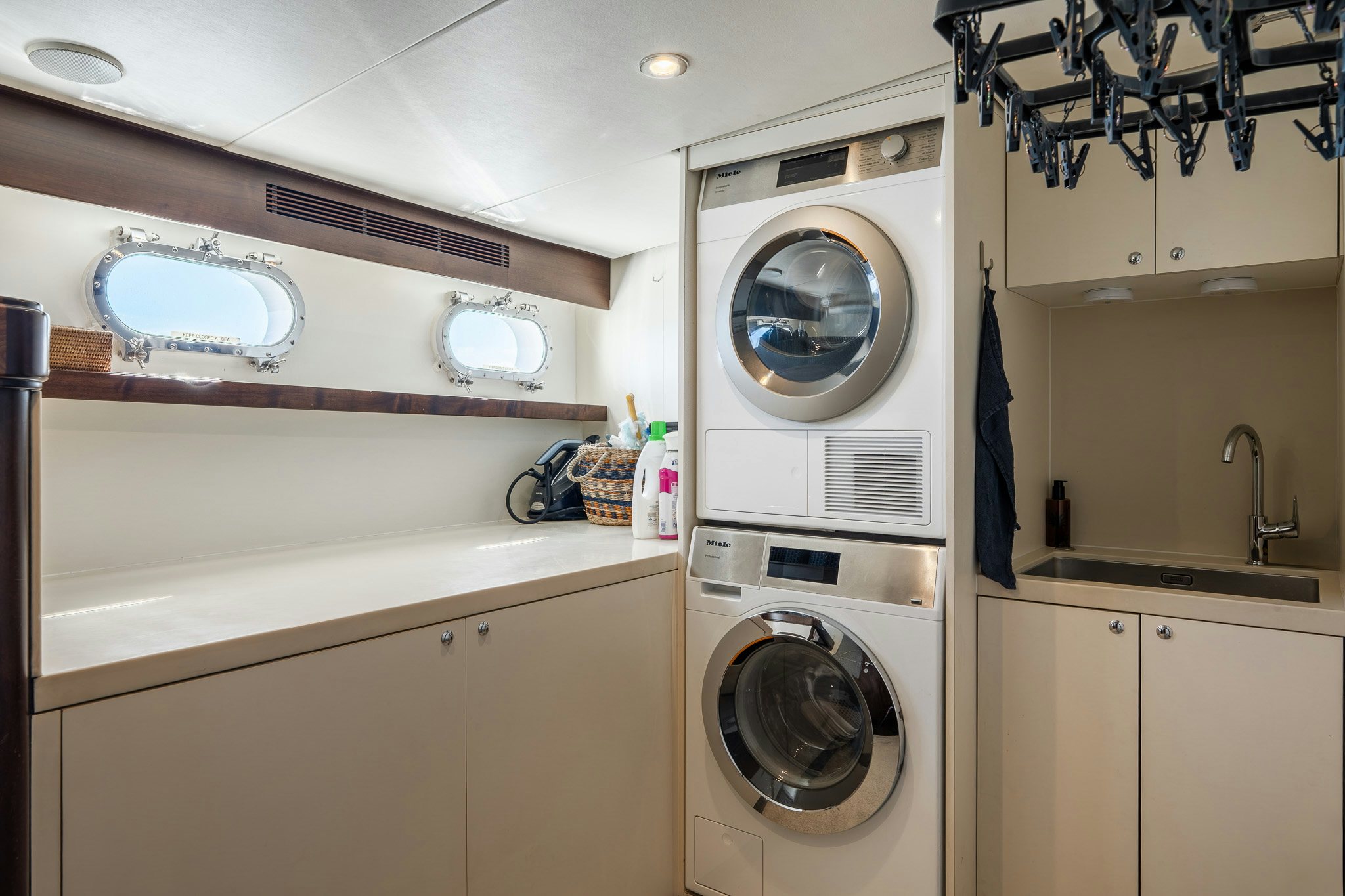 a washing machine in a kitchen aboard SULTANA Yacht for Sale