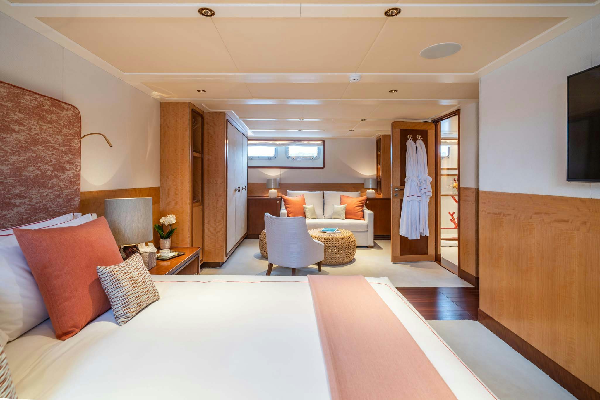 a room with a bed and a couch aboard SYNTHESIS 66 Yacht for Charter