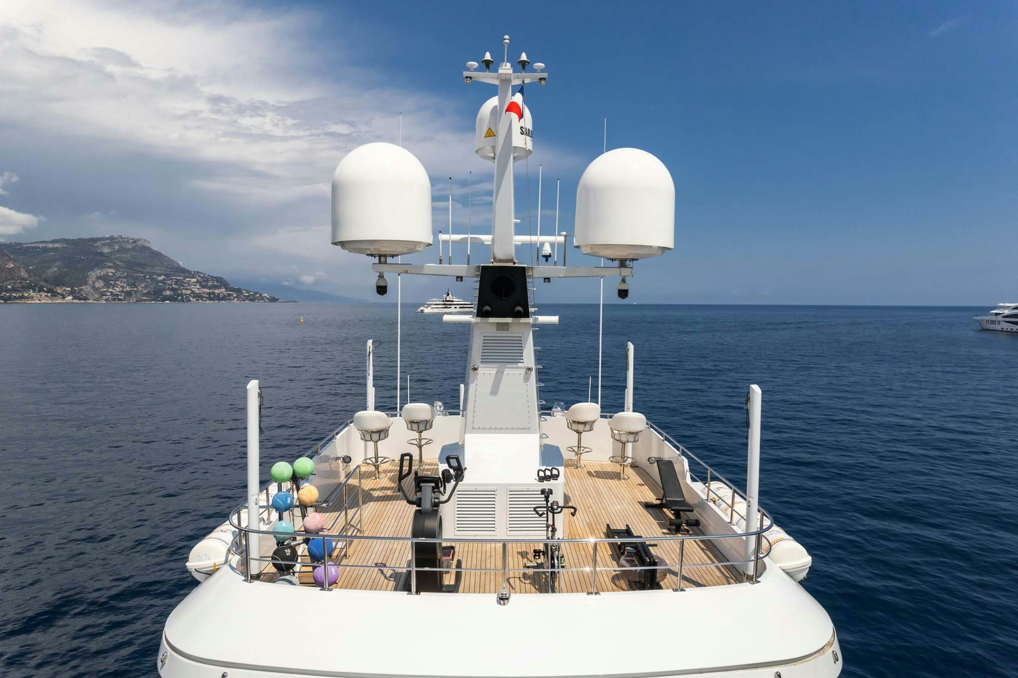 a boat with a group of people on it in the water aboard SYNTHESIS 66 Yacht for Charter