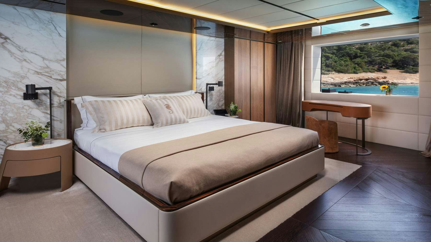 a bed in a room aboard GECO Yacht for Charter