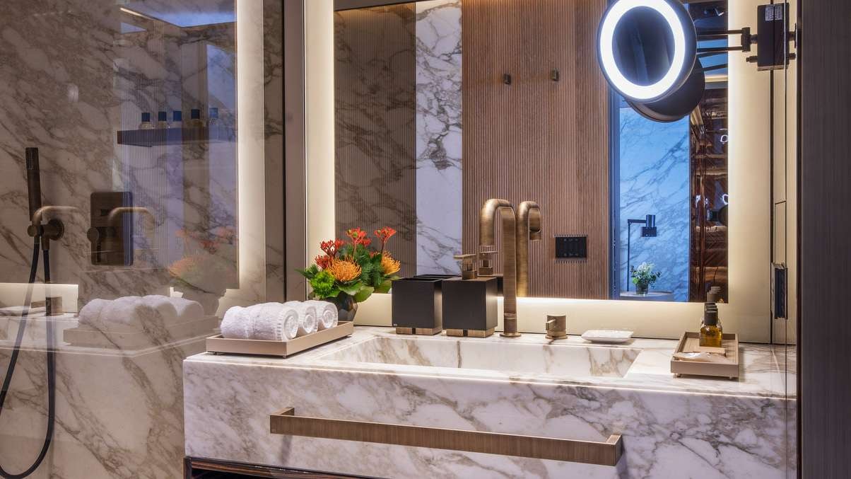 a bathroom with a large mirror aboard GECO Yacht for Charter