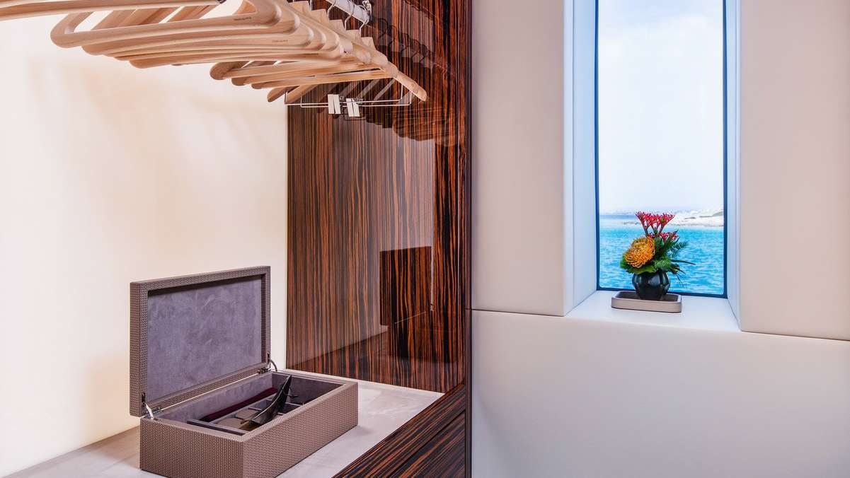 a room with a tv and a window aboard GECO Yacht for Charter