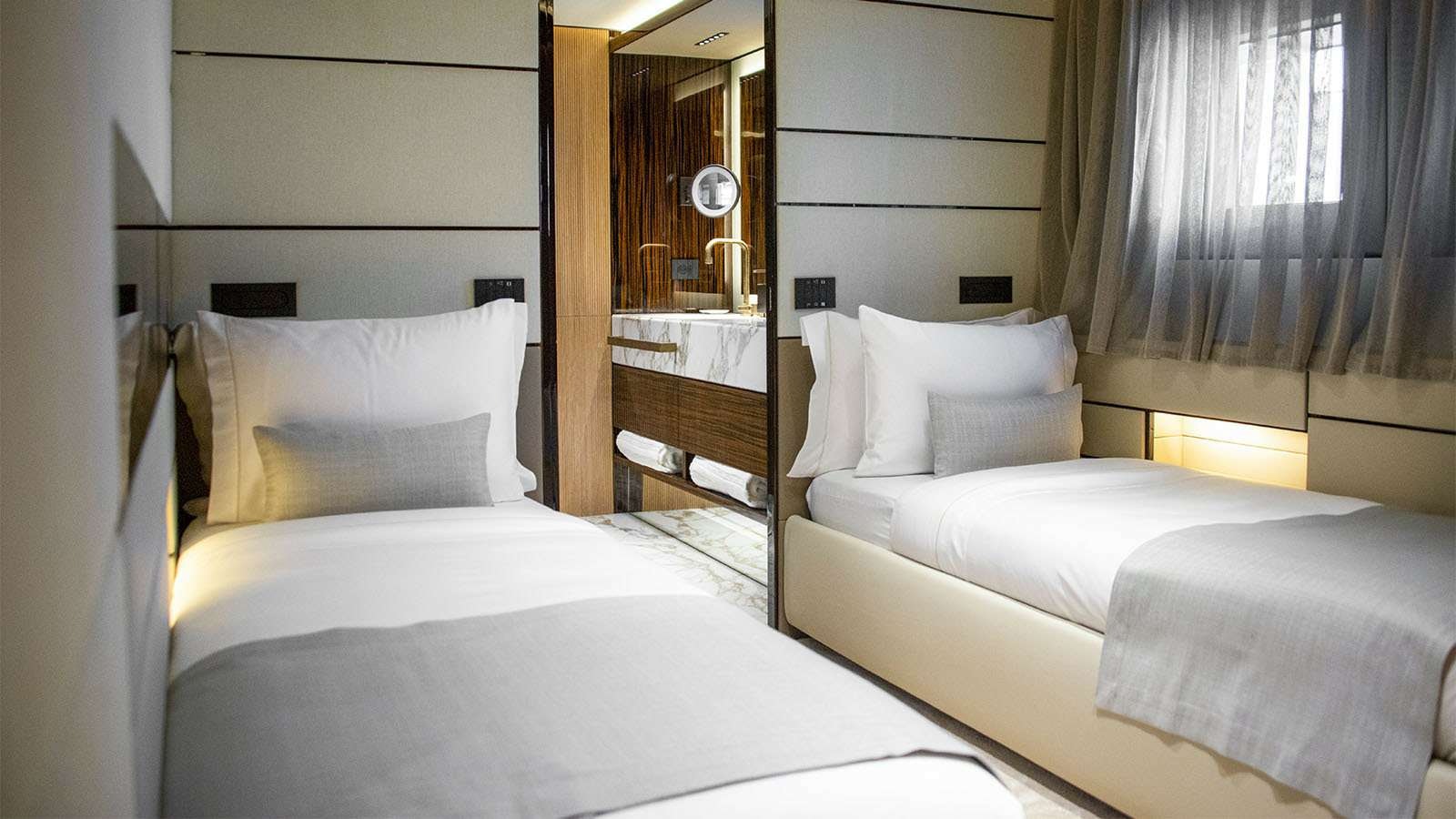 a room with three beds aboard GECO Yacht for Charter
