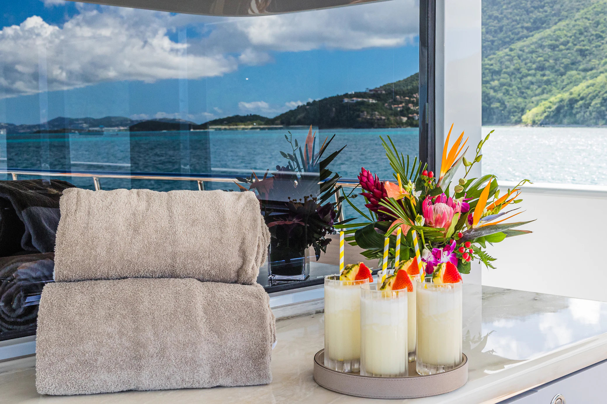 a table with candles and flowers on it aboard AVALON Yacht for Charter