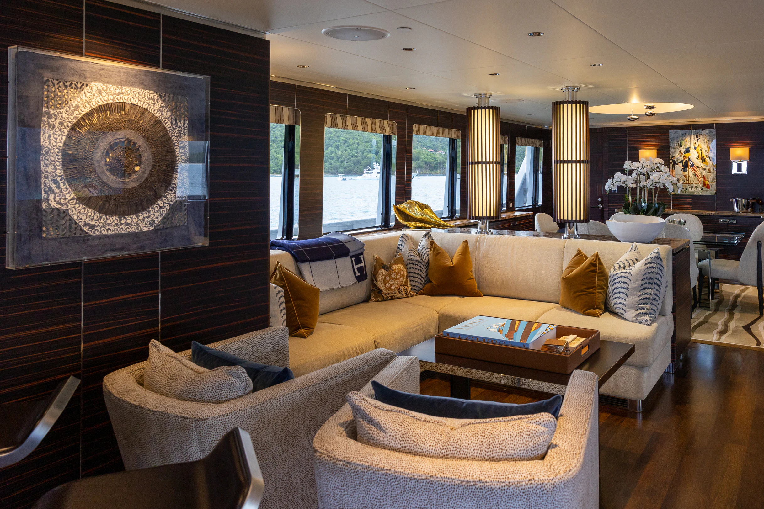 a living room with a large painting aboard AVALON Yacht for Charter